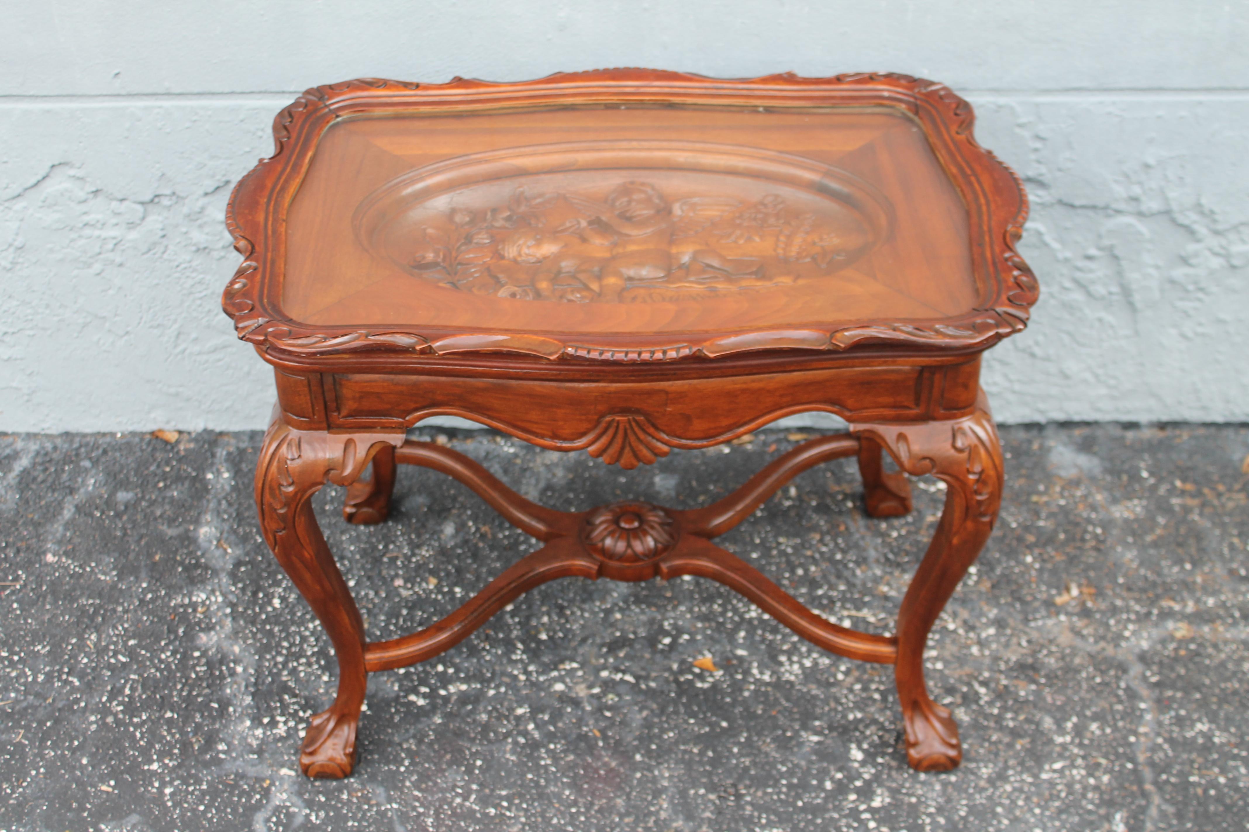 1940's Traditional style Carved Wood Tray Table. Beautiful carved Cherub detail. Removable tray top.