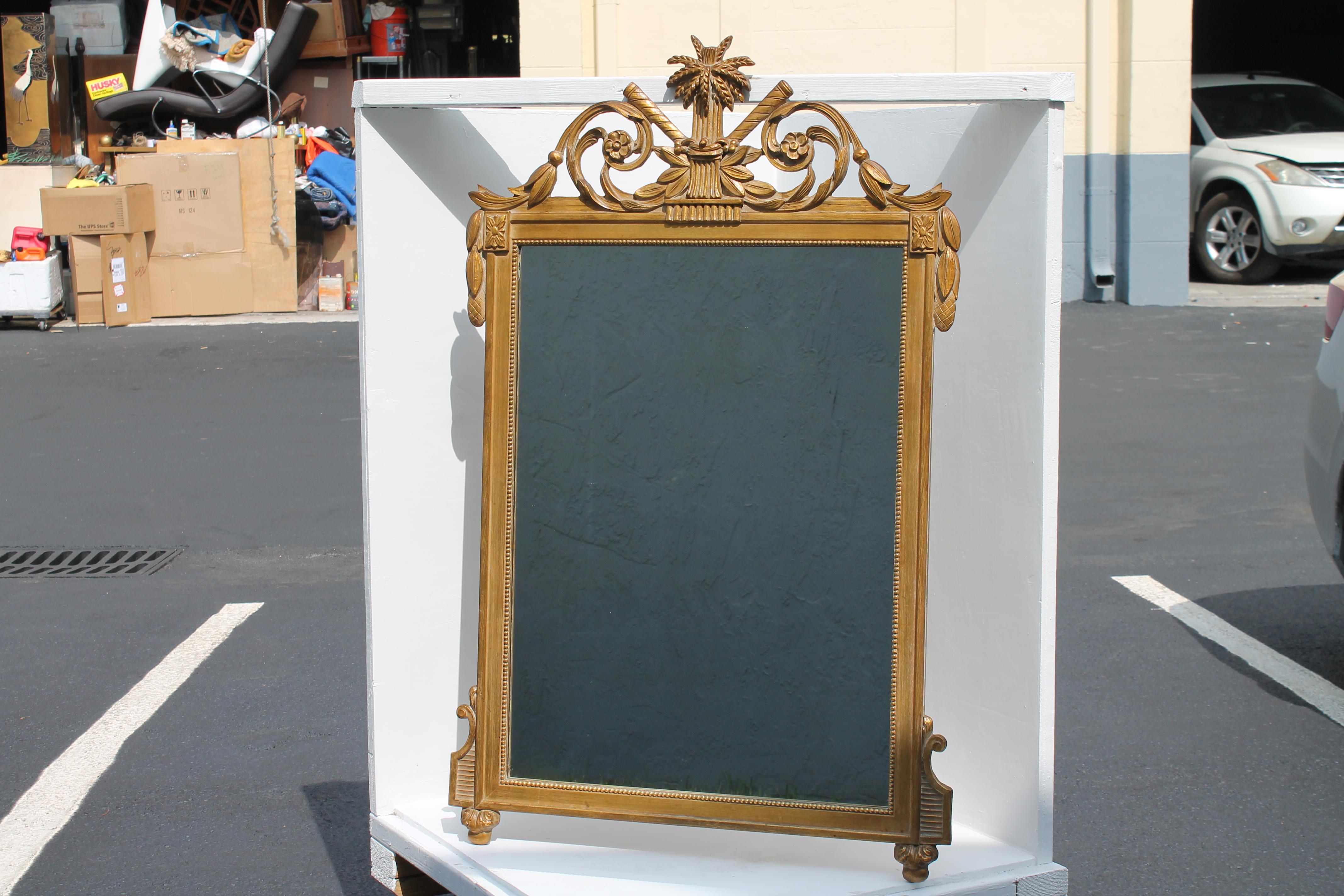 1940s Traditional style Carved and Giltwood/ Gesso Wall Mirror. Classic carving. Wheat detail. Miami Estate.