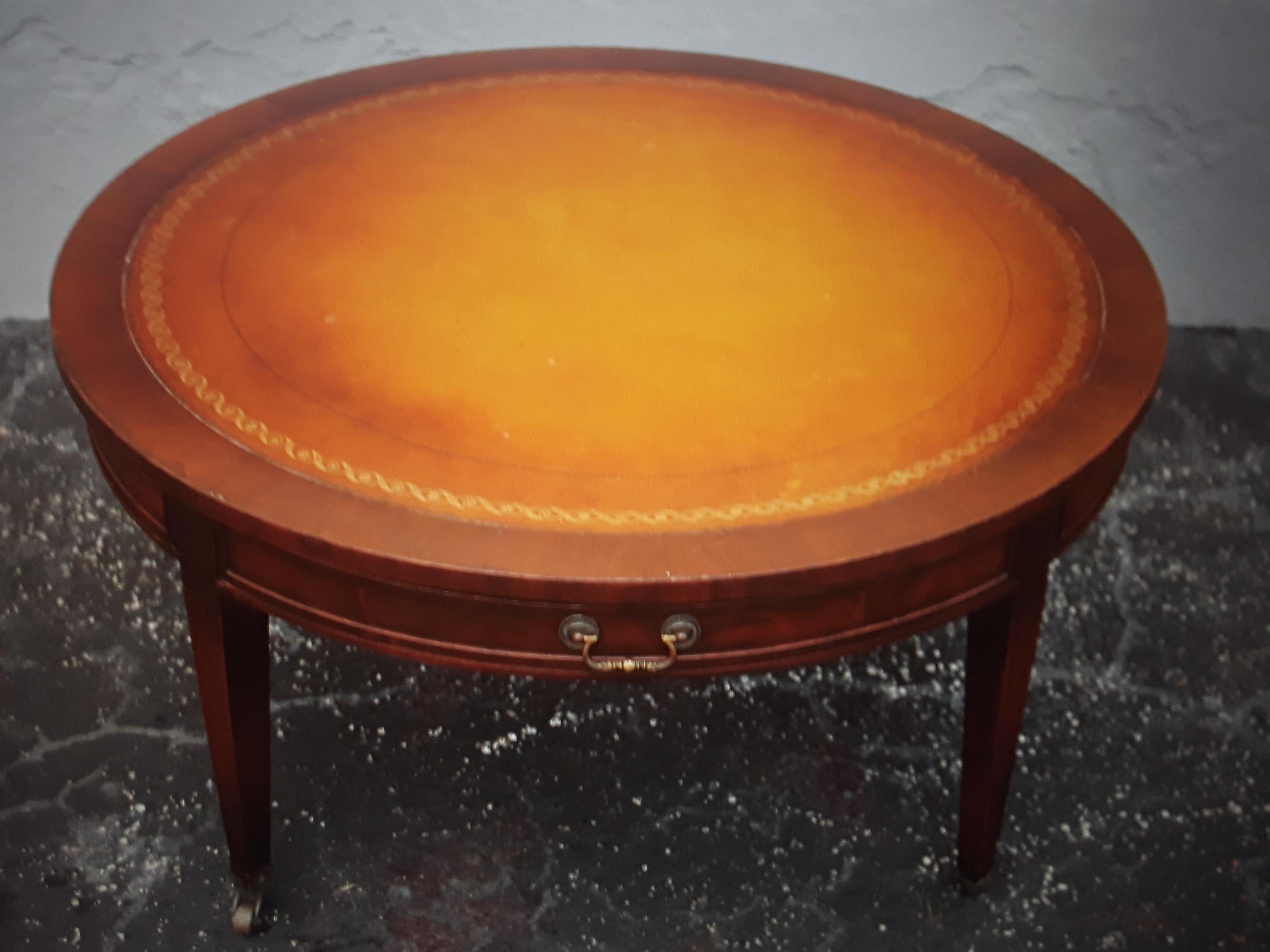 1940's Traditional style Round Leather Top Mahogany Coffee/ Cocktail Table. 1 drawer storage. 