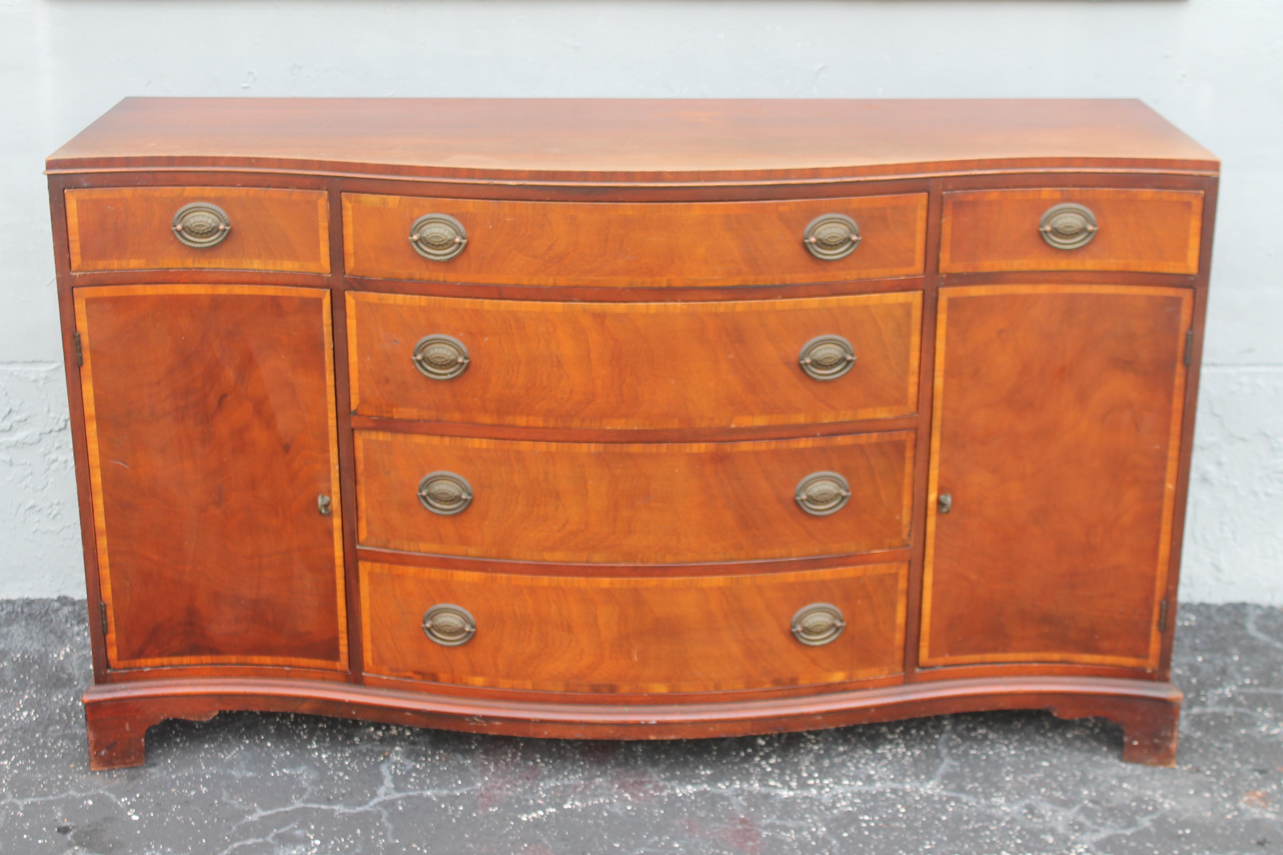 1940's Traditional style Mahogany Buffet/ Credenza/ Sideboard/ Dry Bar. Beautifully detailed mahogany. Great storage space. Center bank of drawers.
