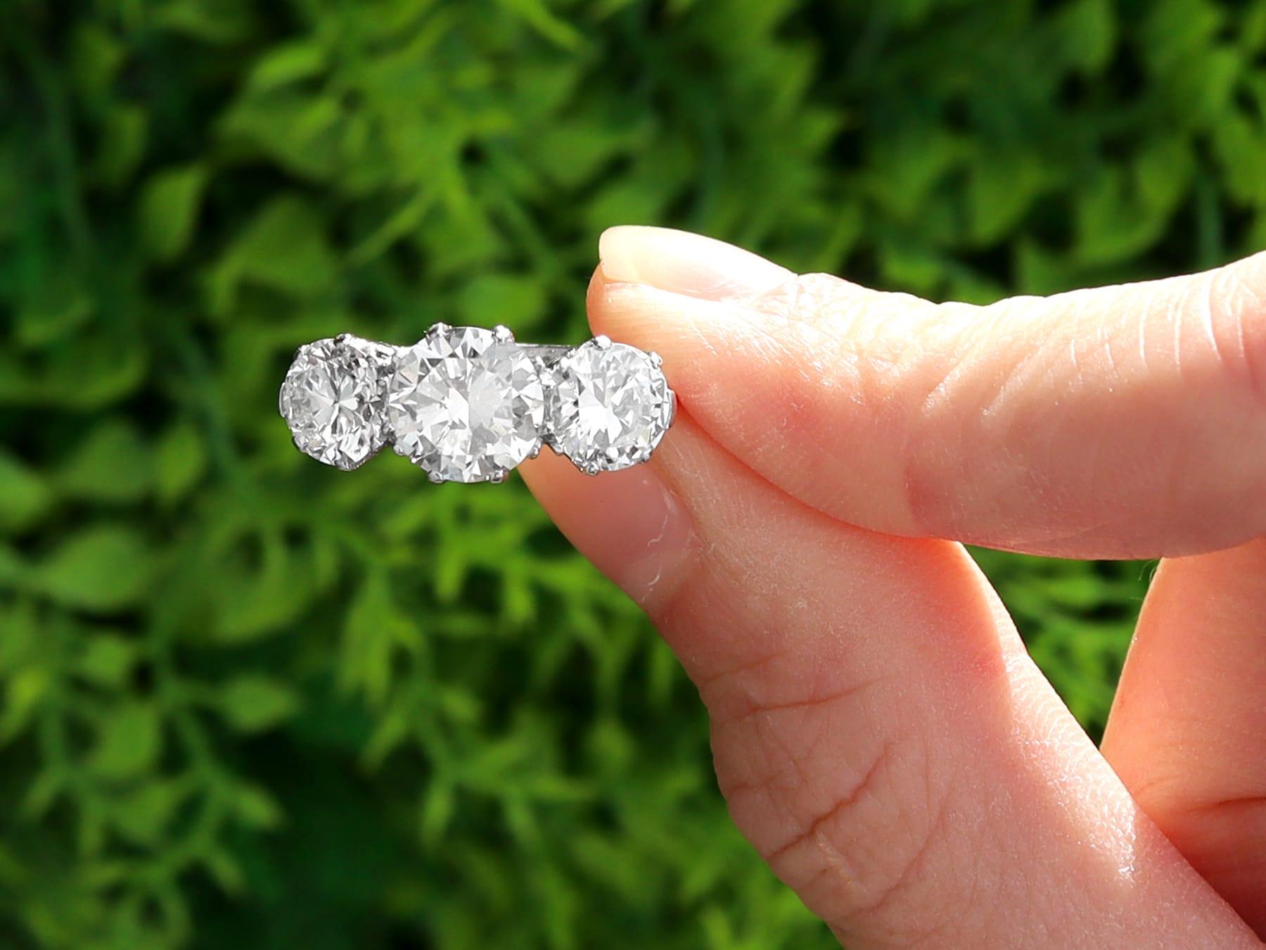 A magnificent, fine, impressive and stunning vintage 3.84 carat diamond and platinum trilogy ring; part of our diverse collection of diamond engagement rings. 

This magnificent, fine and impressive vintage trilogy diamond ring has been crafted in