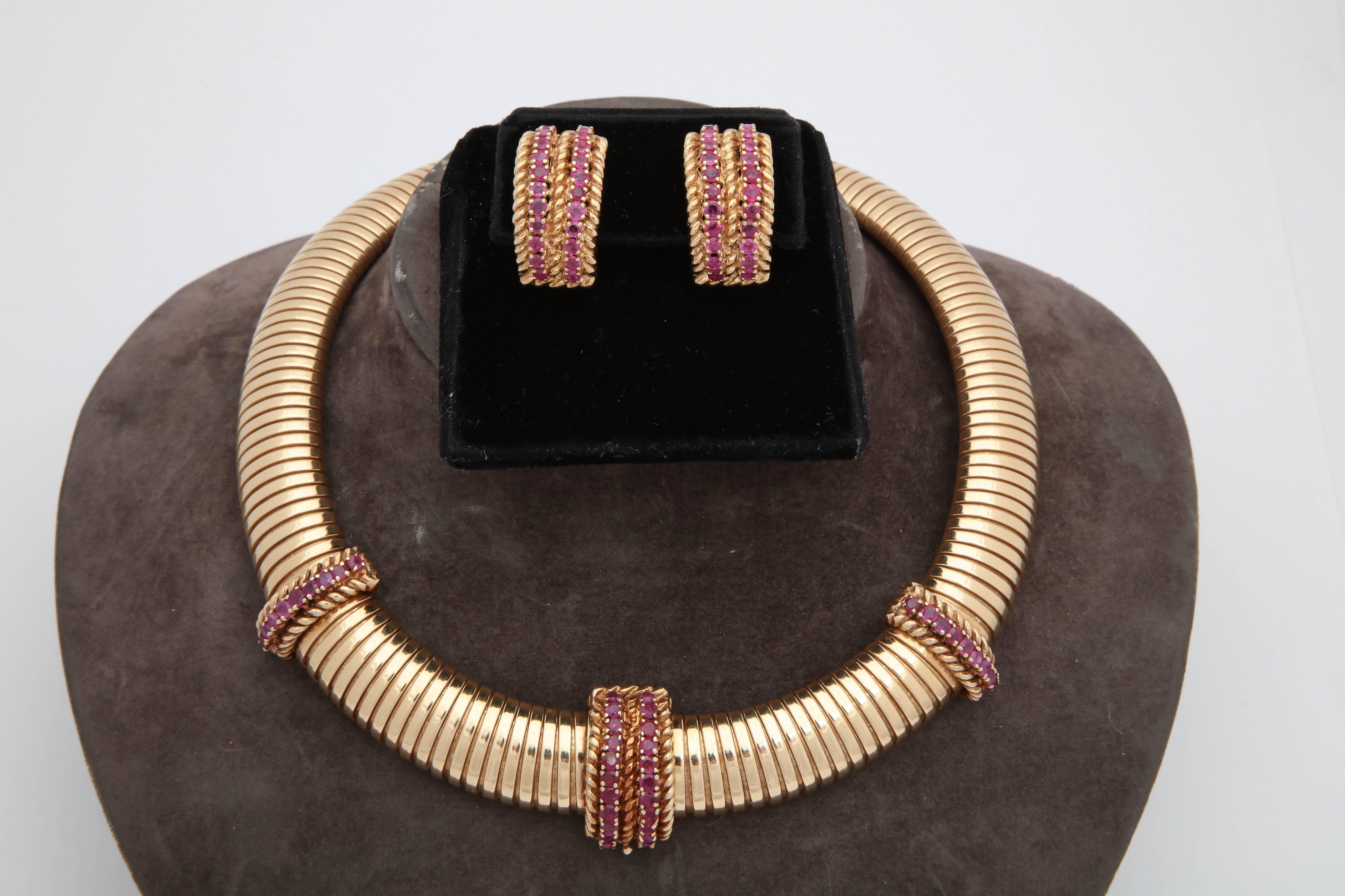 One Ladies 14kt Gold Three Dimensional,Tubular Gaspipe Necklace With Easy Fastener For Clasp Which May Be Worn In The Front. 14kt Gold Clasp Is embellished With Numerous  Faceted Rubies Weighing Approximately 2.40 Cts. The Choker Style Necklace Is