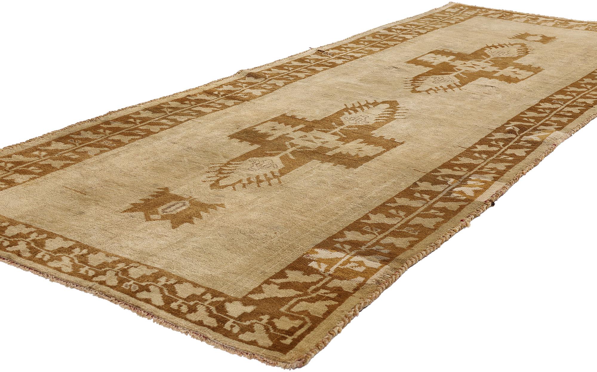 50023 Vintage Turkish Oushak Runner, 03'06 x 09'03. Step into the world of timeless elegance with this one-of-a-kind, hand-knotted wool vintage Turkish Oushak rug runner — a piece that whispers stories of Anatolian nobility and ancient protection.