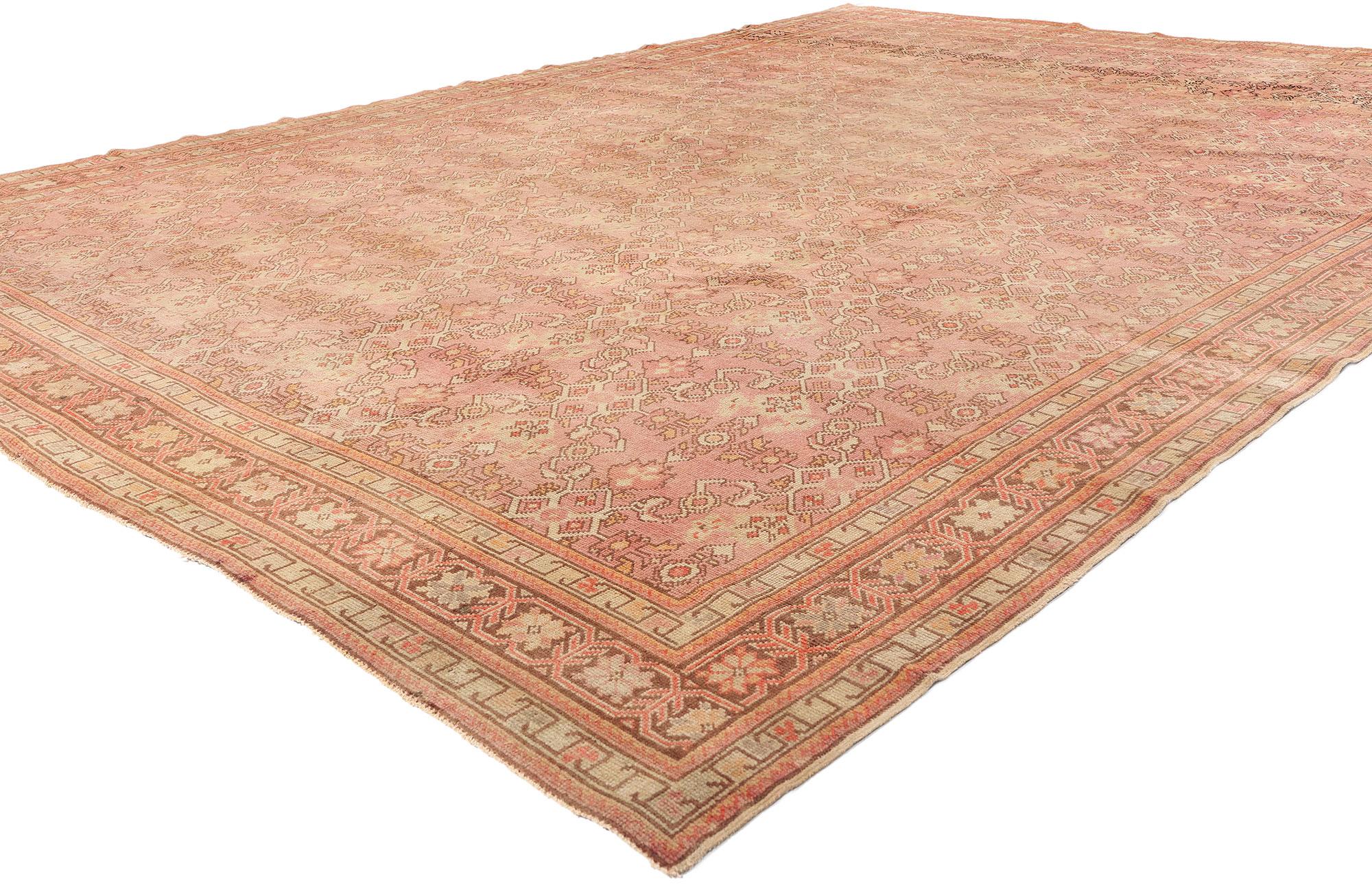 52289 Vintage Pink Turkish Oushak Rug, 09'08 x 13'00. This hand-knotted wool vintage Turkish Oushak rug is an extraordinary masterpiece, a sublime celebration of Anatolian heritage and craftsmanship, where classic geometry meets floral elegance in