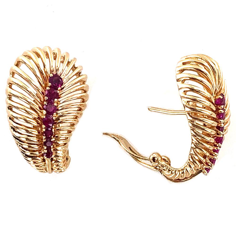 Retro ruby earrings circa 1940's by Van Cleef & Arpels. The earrings are fashioned in 14 karat yellow gold and feature 14 ruby gemstones. They each measure 18 x 25mm and are signed VCA NY numbered 22... 14k.  