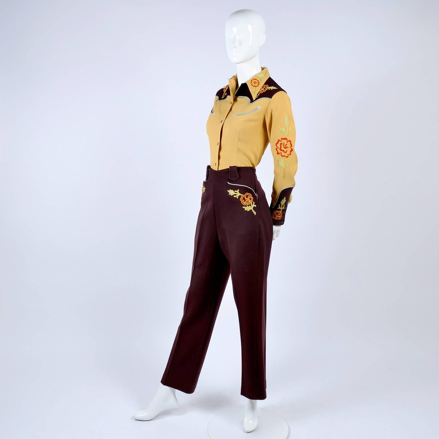 This is a vintage 1940's Western Shirt and pants cowgirl outfit from Vaquero Fashions by Taylor Berke.  The shirt is gold gabardine with brown and it is embroidered with crewel style embroidery. There are red roses with green leaves on the collar,