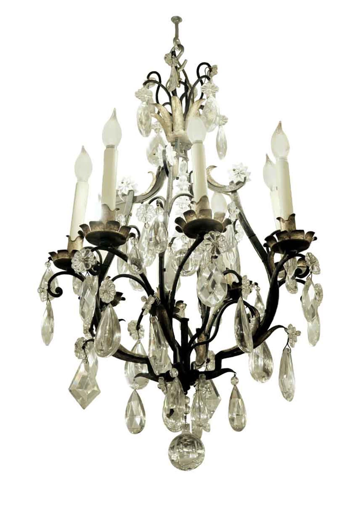 Venetian style iron six arm chandelier with gilded gold leafed metal details and heavy cut crystals from the 1940s. Cleaned and rewired. Please note, this item is located in one of our NYC locations.