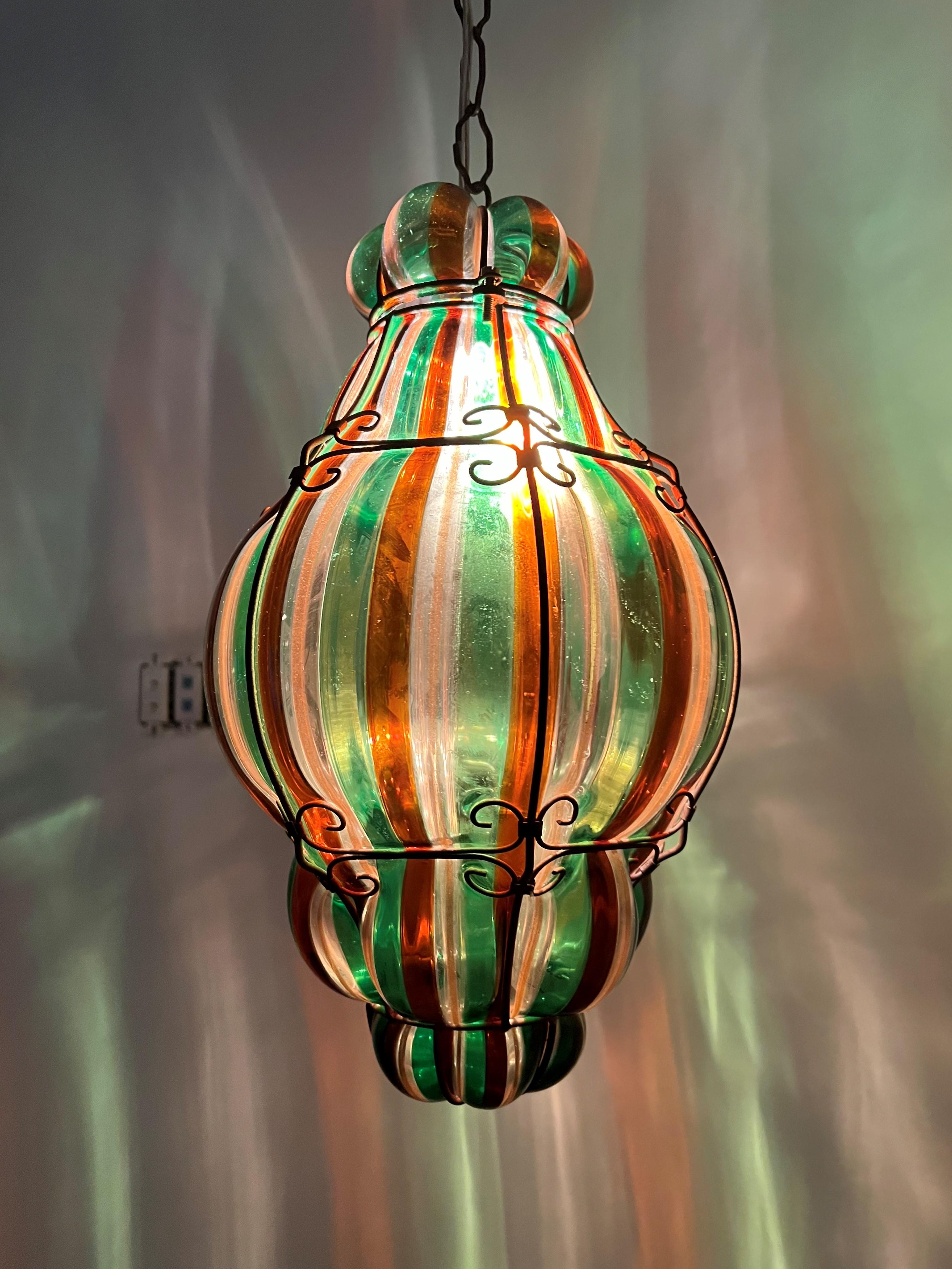 Designer:
Fulvio Bianconi (1915-1996)

Ceiling Light / lantern circa 1940s, manufactured by Venini in multicoloured Murano blown glass and steel armature.
The glass presents no damages but the armature has rusted. This can be corrected and