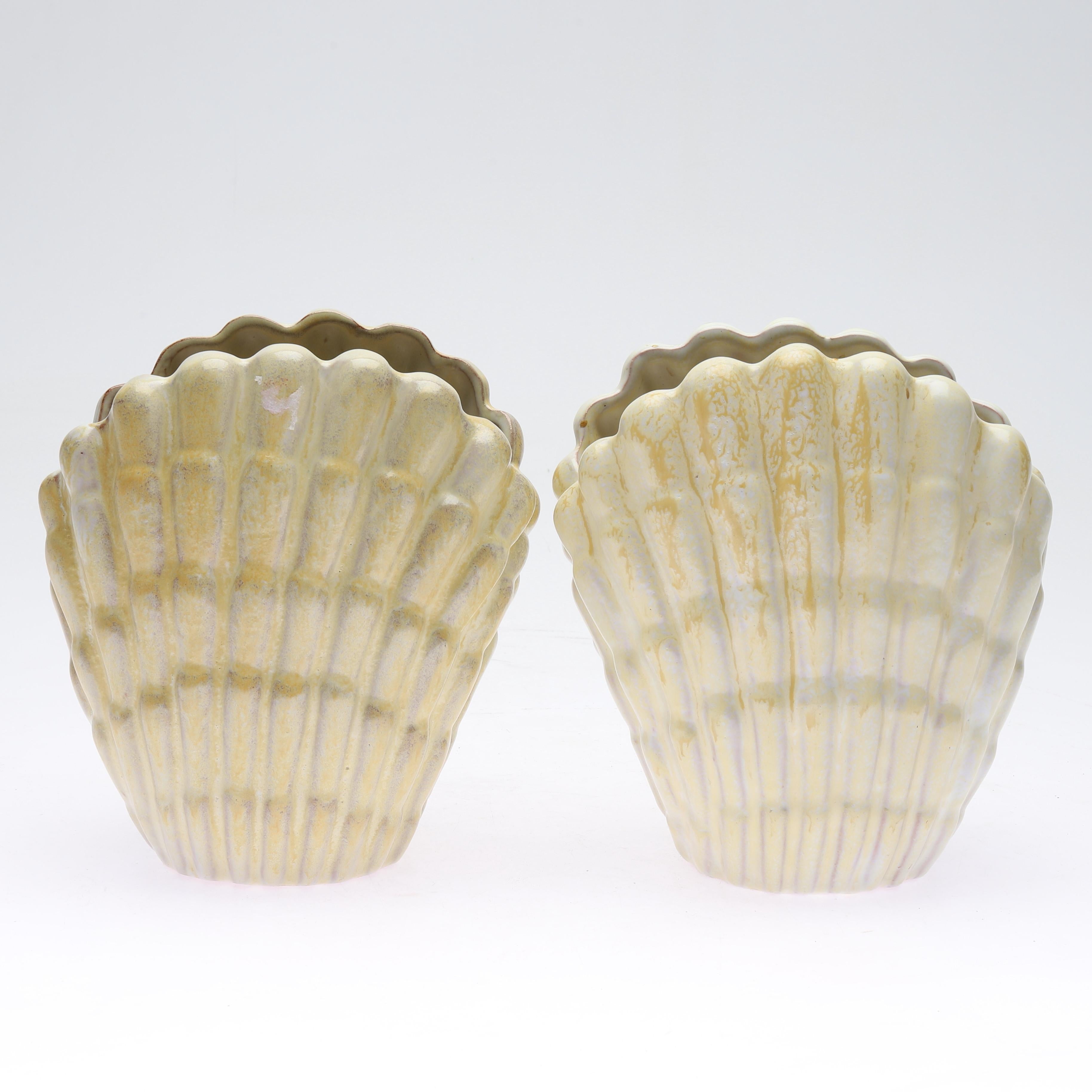 Shell vases designed by Vicke Lindstrand for Upsala Ekeby. Can be purchased separately as well!

Upsala-Ekeby AB was a porcelain, tile, brick, and glass company founded in 1886 in Uppsala, Sweden. Other designers of the period include Ettore