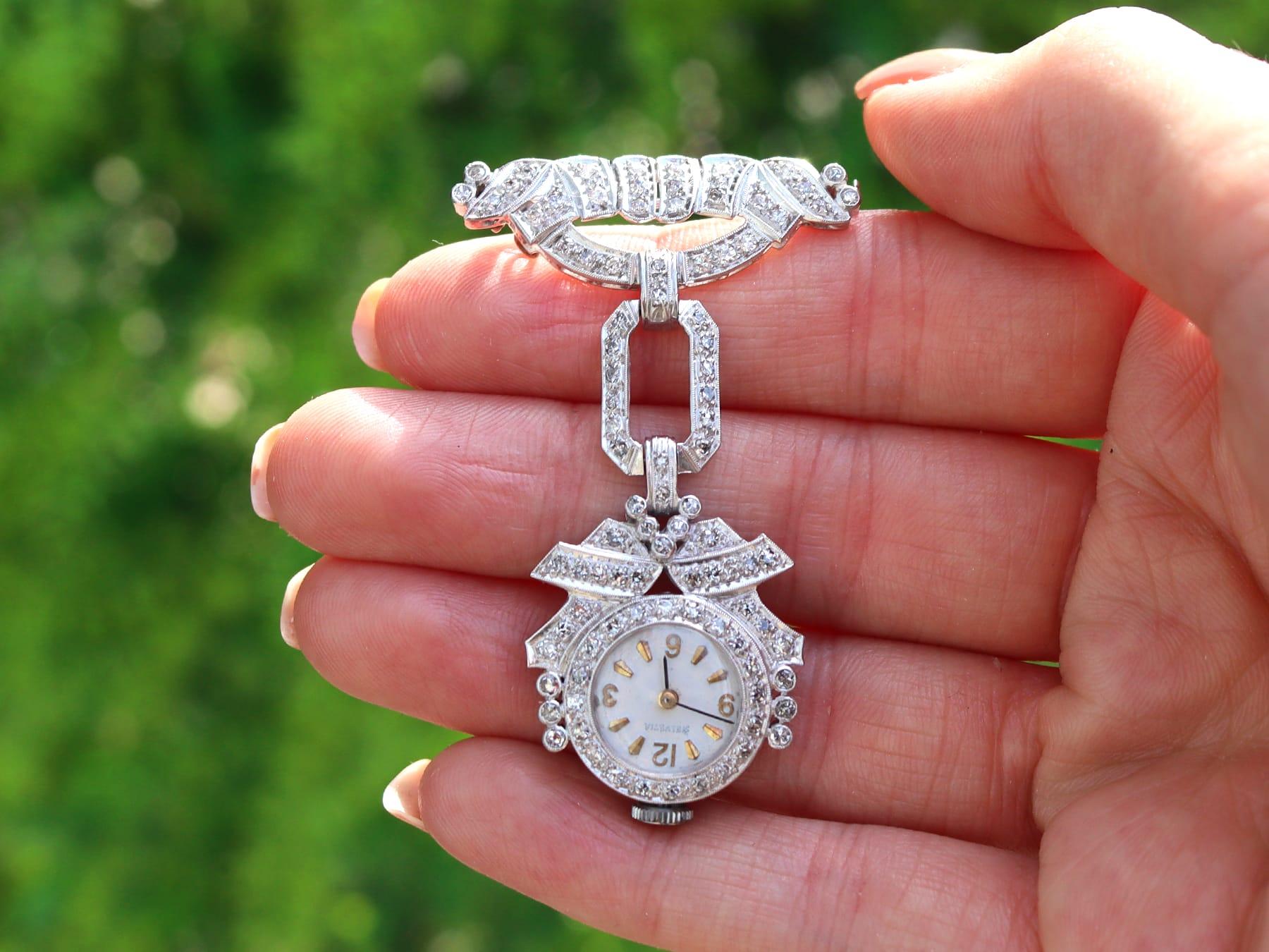 An impressive vintage Art Deco 1.50 carat diamond and platinum cocktail fob watch by 'Helvetia'; part of our diverse diamond jewelry and estate jewelry collections.

This fine and impressive diamond Art Deco fob watch has been crafted in