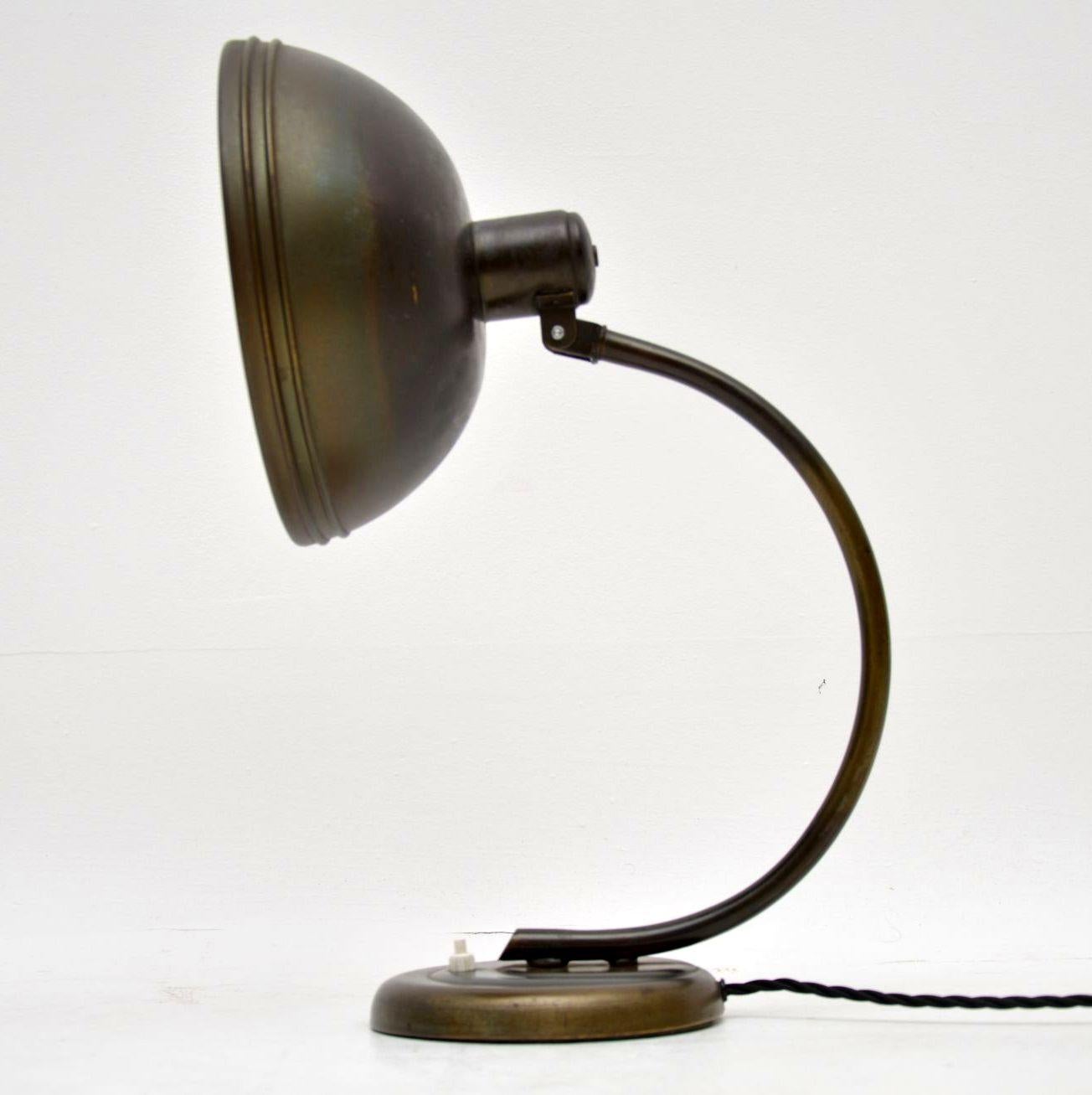 A beautiful early midcentury table lamp darting from circa 1940s-1950s, this is very much in the Bauhaus style, it originates from central Europe. The condition is lovely, it’s made from metal that has acquired a gorgeous patina. We have had this