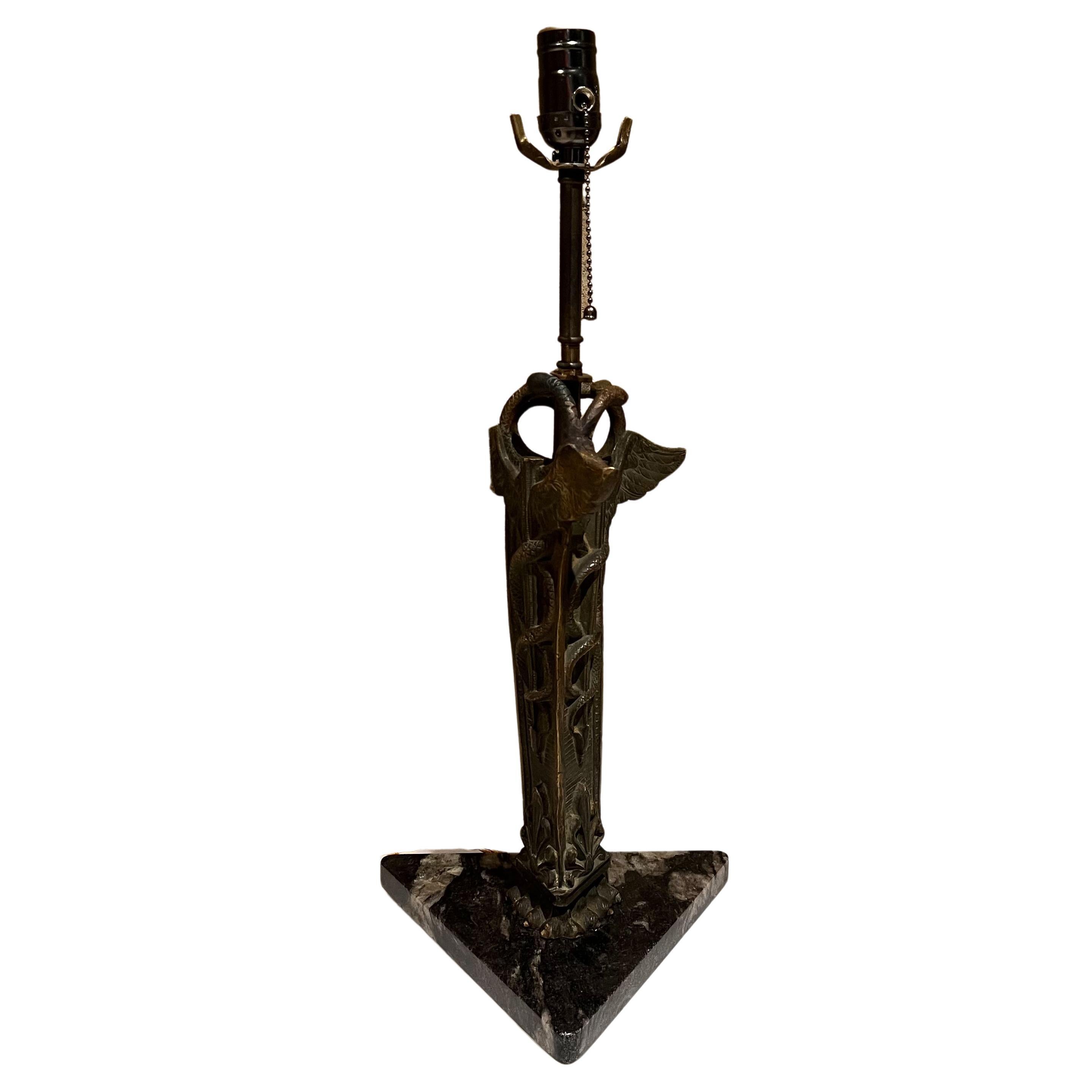 Lovely vintage medical lamp sculpture caduceus scale serpent symbol marble base
Measures: 22 tall x 10 width x 8.5 depth
Decorative carved bronze sculpture marble triangular mount.
New wiring.
Sculpture not in mint condition. It has suffered