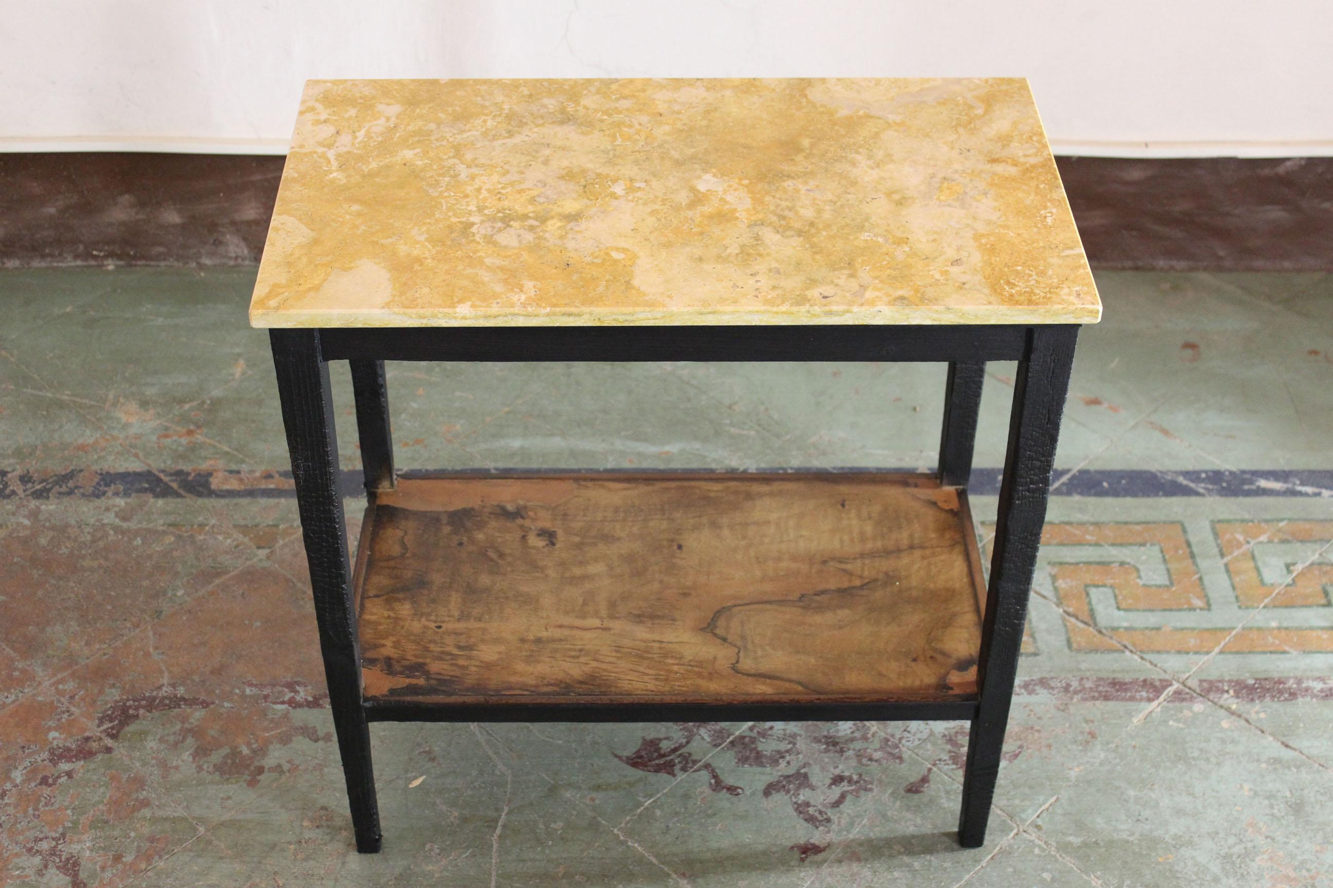 Vintage console table from the 1940s composed by a yellow travertine top and solid wood structure. In excellent conditions. The structure parts in black is the result of the use of japanese wood conservative technique 