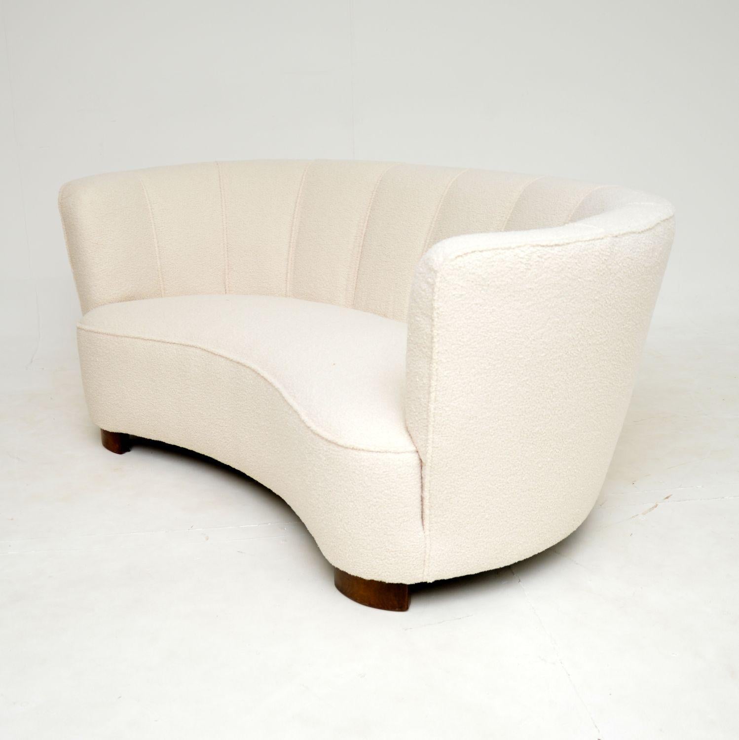 A fantastic vintage Danish curved banana cocktail sofa dating from the 1940’s. This was recently imported from Denmark.

This is of superb quality, it is very well built and very comfortable. It is a great size, comfortably seating two and it can