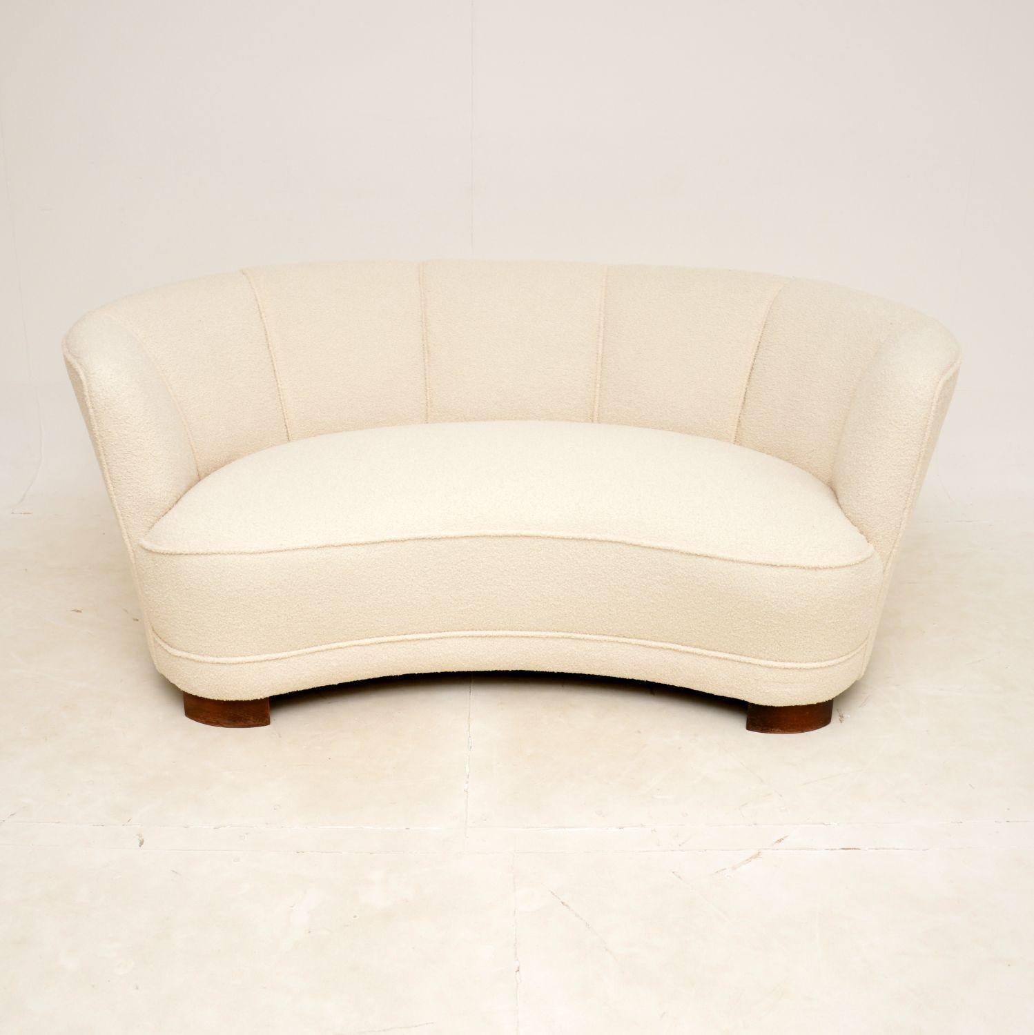 A fantastic vintage Danish curved banana cocktail sofa dating from the 1940’s. This was recently imported from Denmark.

This is of superb quality, it is very well built and very comfortable. It is a great size, comfortably seating two and it can