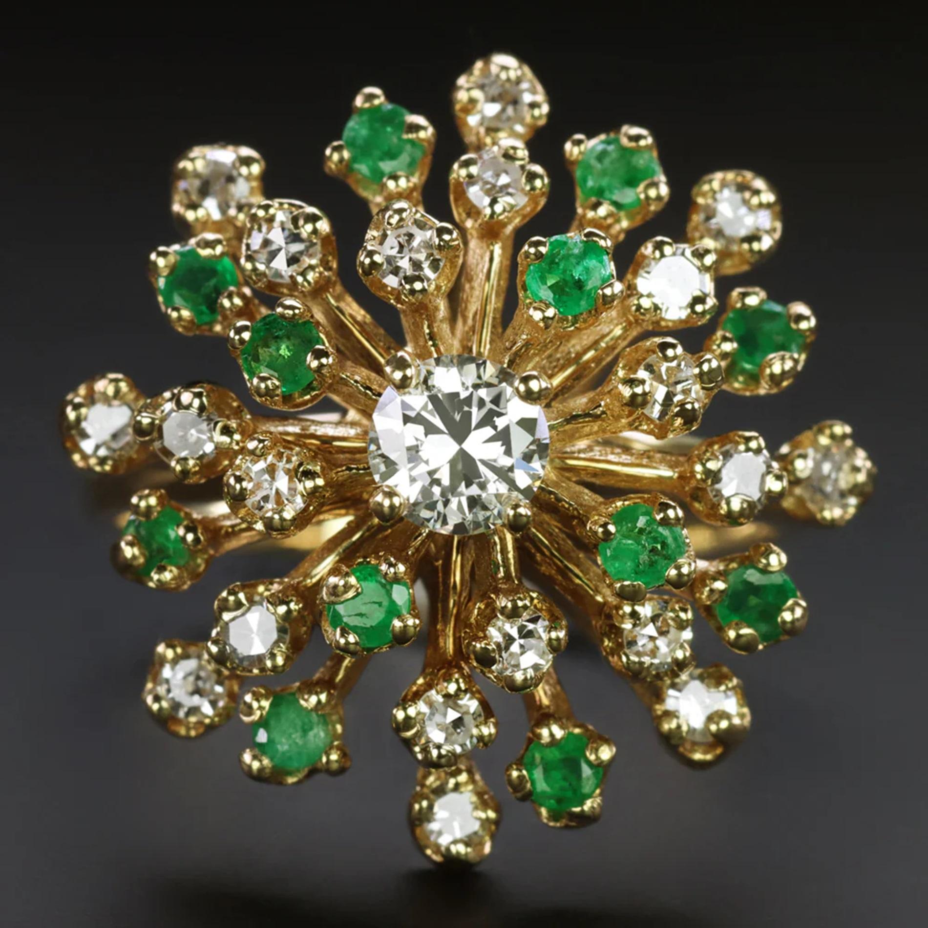 Introducing a mesmerizing vintage ring showcasing a radiant cluster of diamonds and emeralds swirling around a vibrant diamond center. Each tier of this unique design partially rotates, creating a captivating twinkling effect that is both satisfying