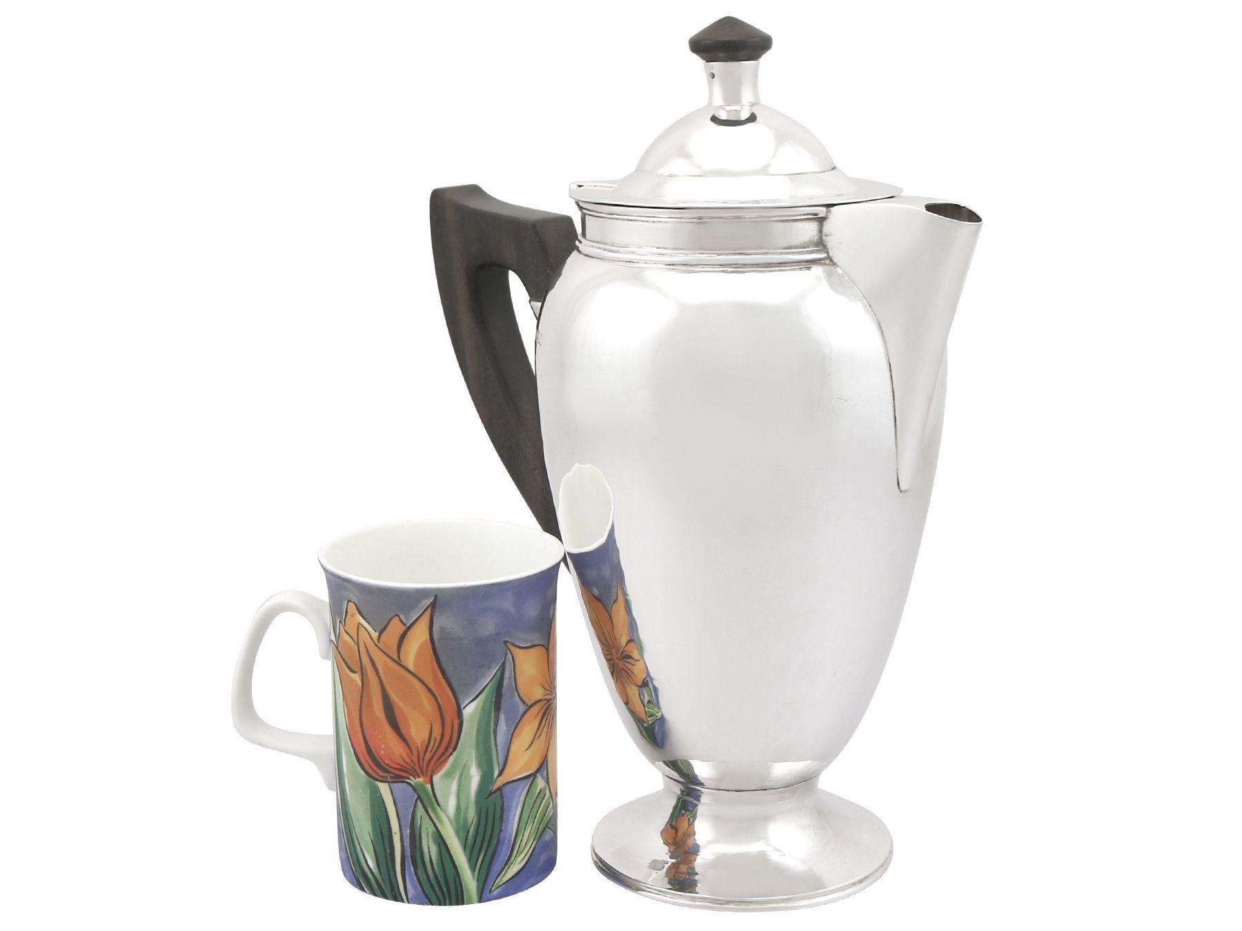 An exceptional, fine and impressive, large vintage George VI English sterling silver coffee pot; an addition to our silver teaware collection

This exceptional, large George VI vintage silver coffee pot has a tapering oval rounded form, in the