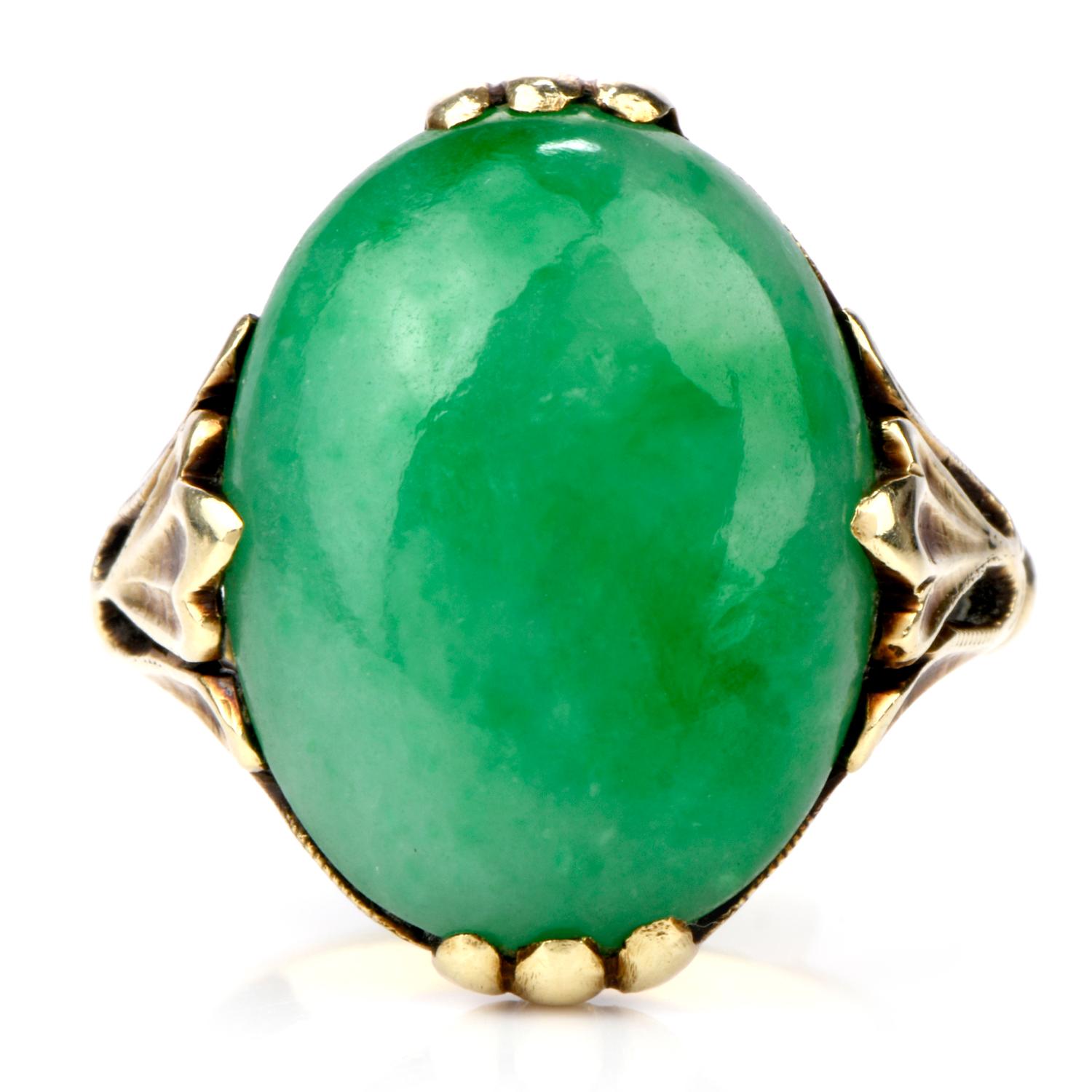 This beautiful Jadeite RIng was inspired in a floral motif

and crafed in 14K yellow gold.

Adorning the center of this ring is a large oval shaped

GIA certified Jadeite measuirng 17.80 x 13.10 x 6.93mm deep

which is secured into the ring by the