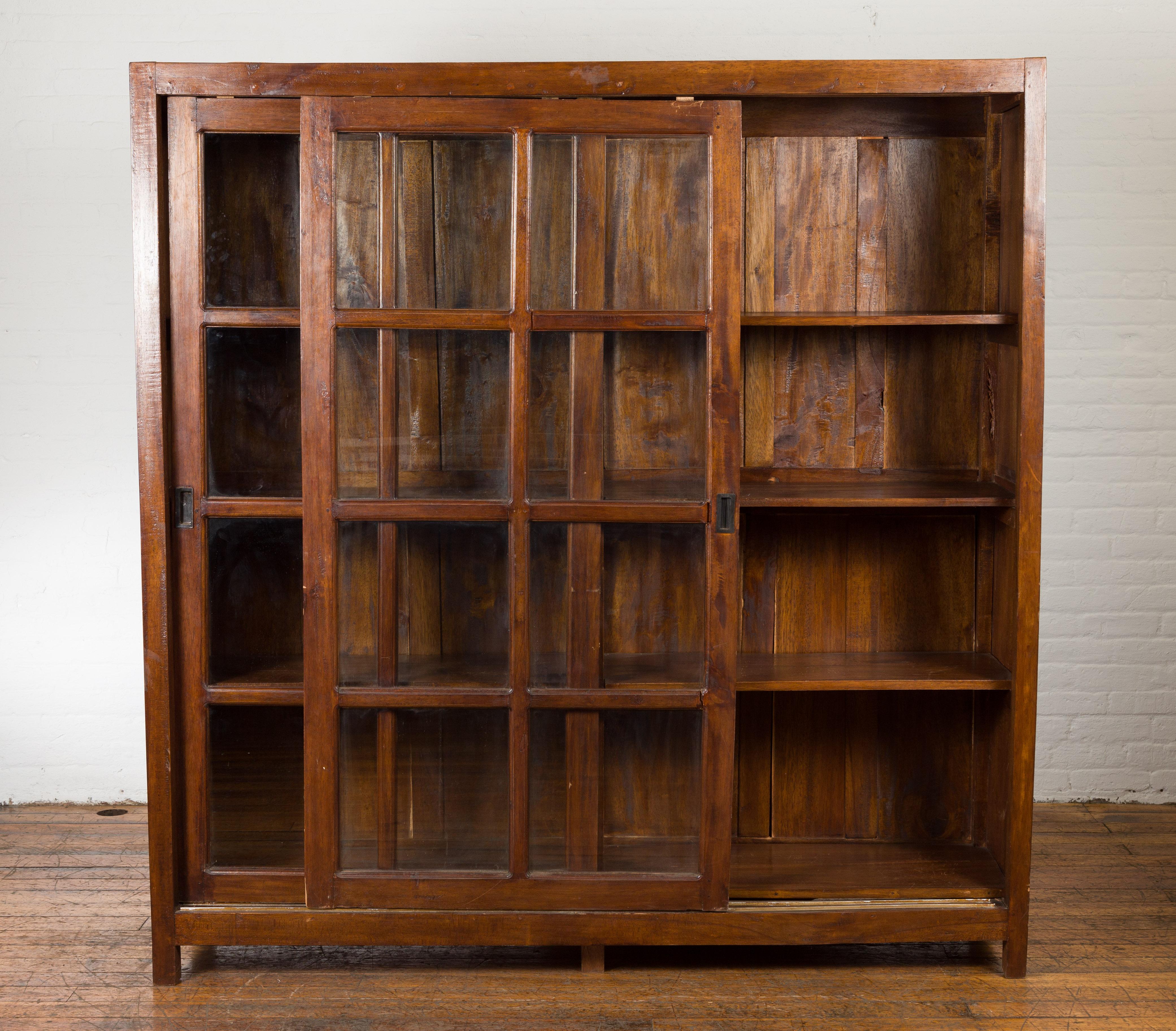 1940s Vintage Javanese Brown Wood Bookcase with Sliding Paneled Glass Doors For Sale 2