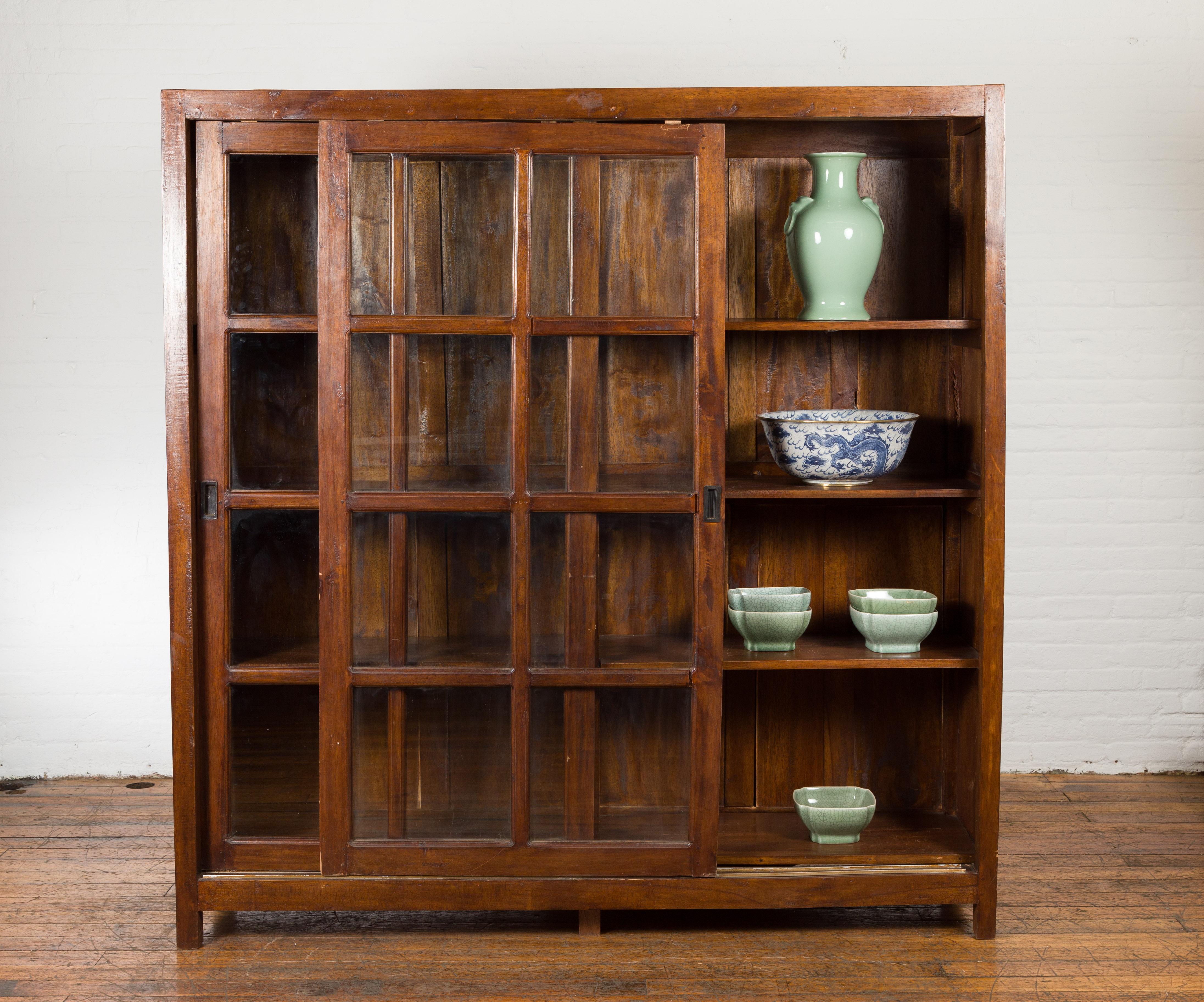 1940s Vintage Javanese Brown Wood Bookcase with Sliding Paneled Glass Doors For Sale 2