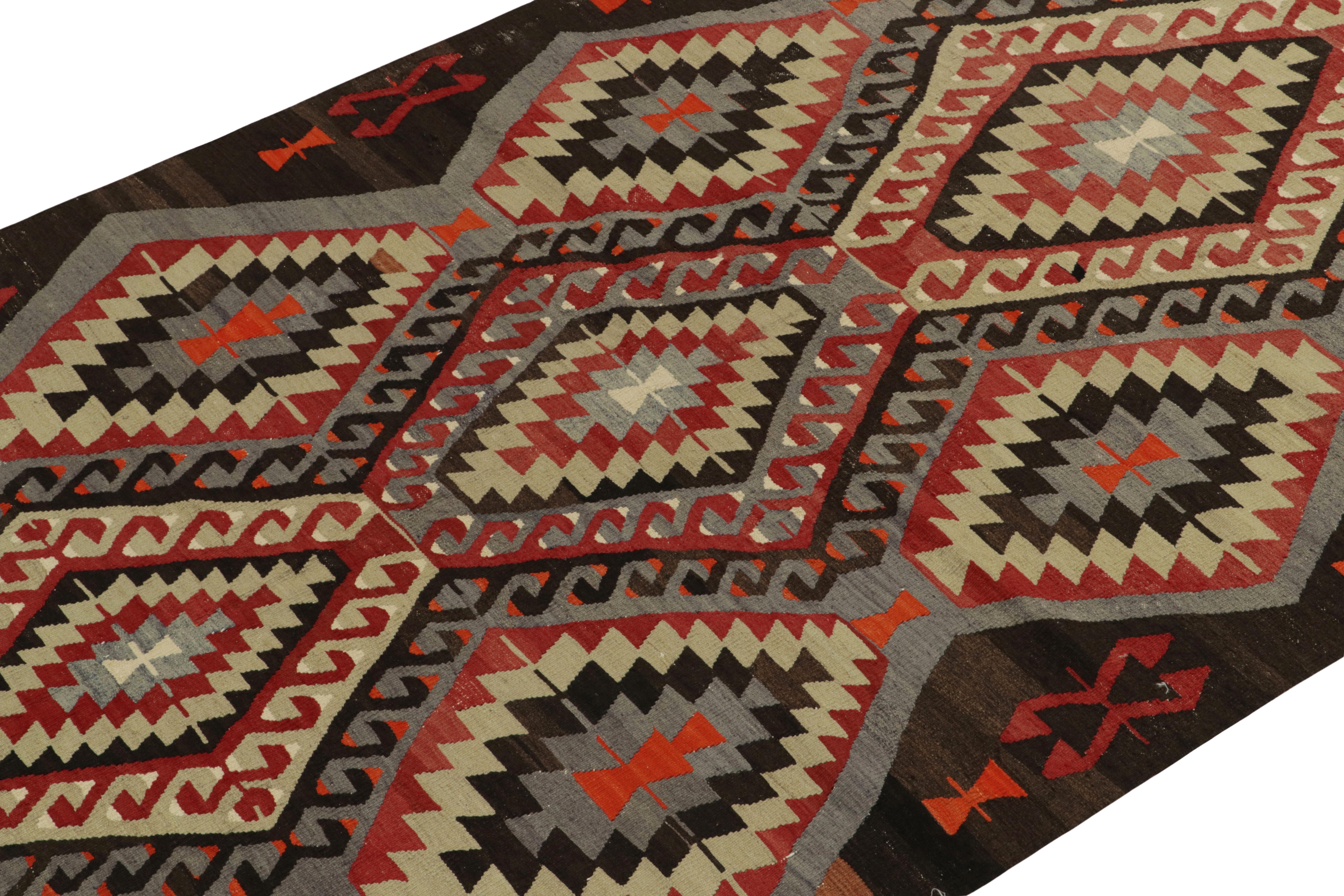 Hailing from Turkey circa 1940-1950, a mid-century kilim rug,  now joining Rug & Kilim’s vintage flat weave selections. The unusual graph revels in rare blue tones with red, white & deep brown rendering a unique presence for its era. Connoisseurs