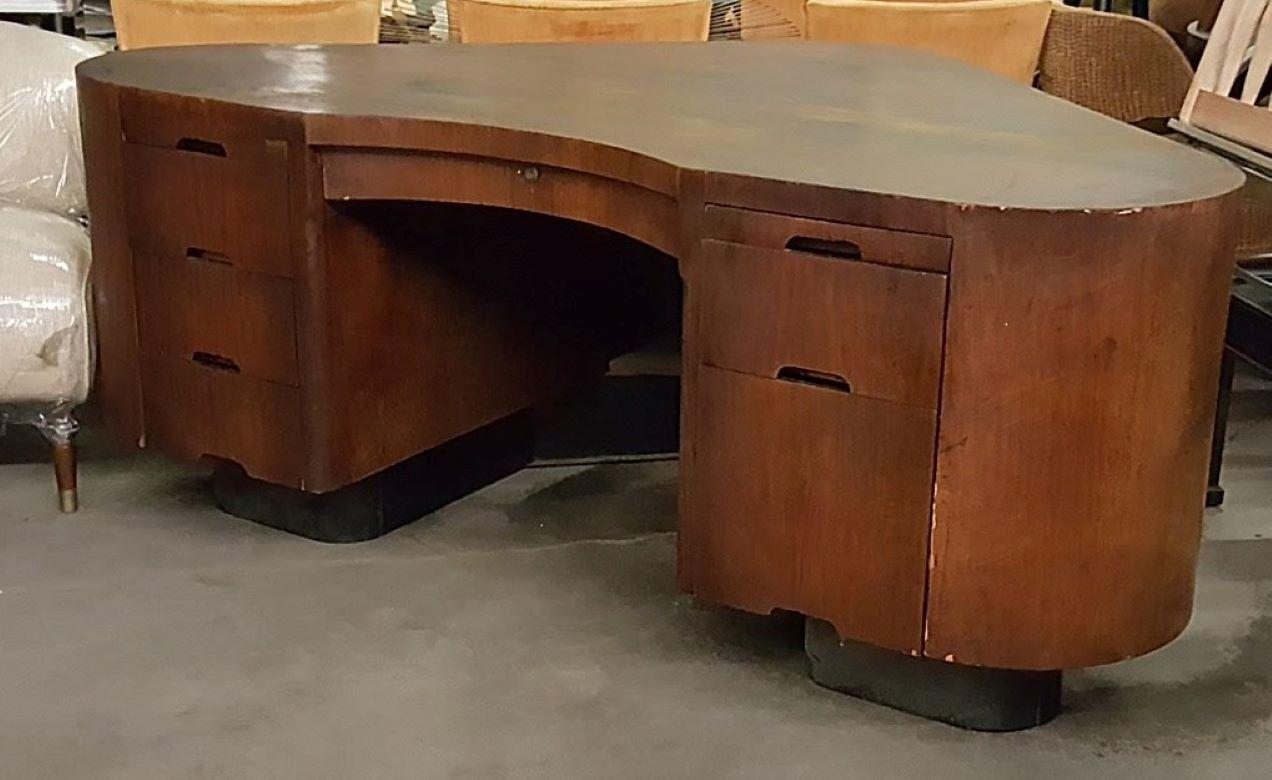Mahogany Art Deco executive desk known as the fletcher aviation desk.

This beautiful Mahogany Art Deco Iconic executive desk. Known As the Fletcher aviation desk is a great American made desk 1940s. It was designed by frank Fletcher and