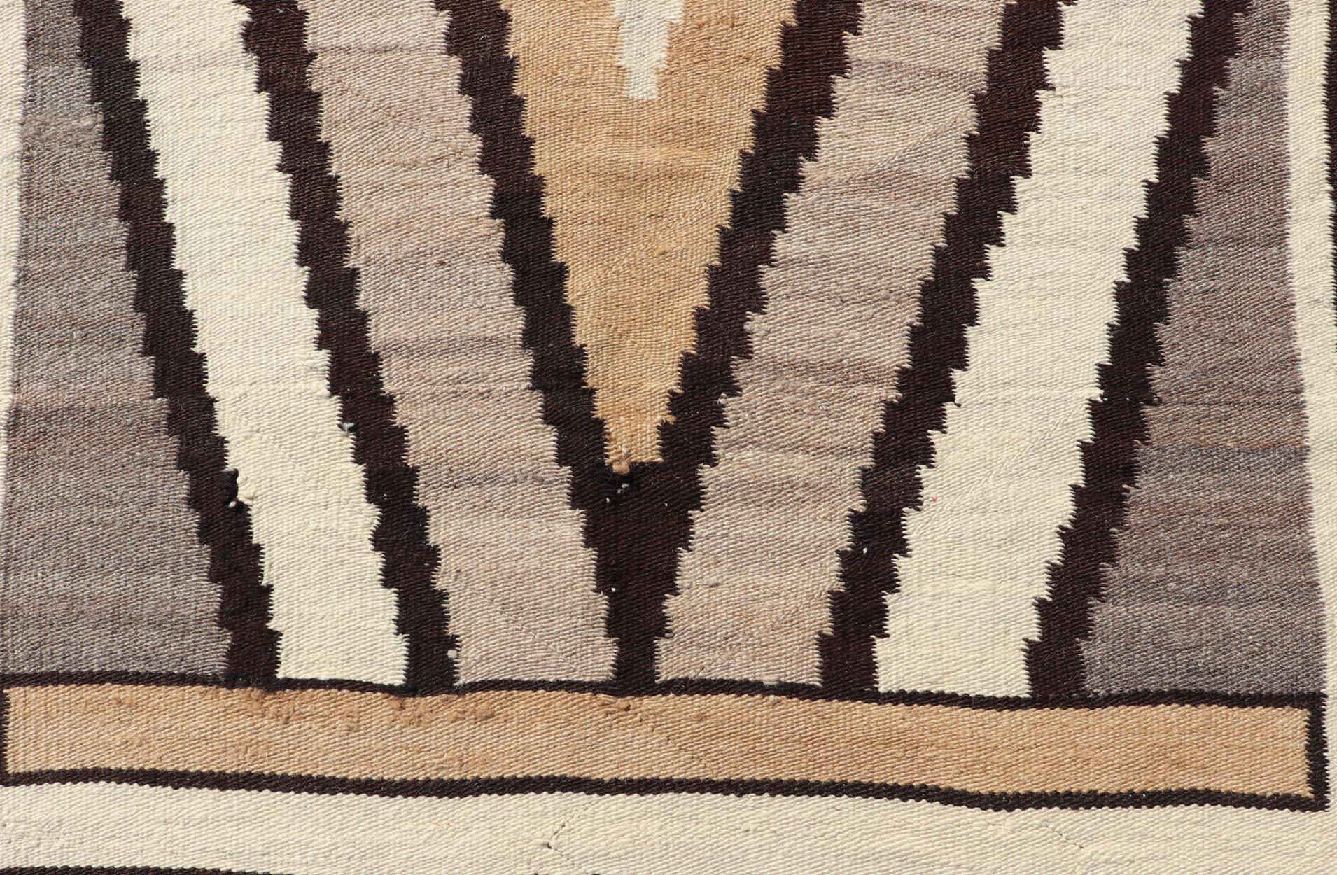 1940s vintage Navajo with Tribal diamond design in earthy tones. 

Measures: 3'7 x 5'
 
American Navajo with geometric diamond design in marigold, brown, black, and ivory. Keivan Woven Arts / rug X23-0105, country of origin / type: America /