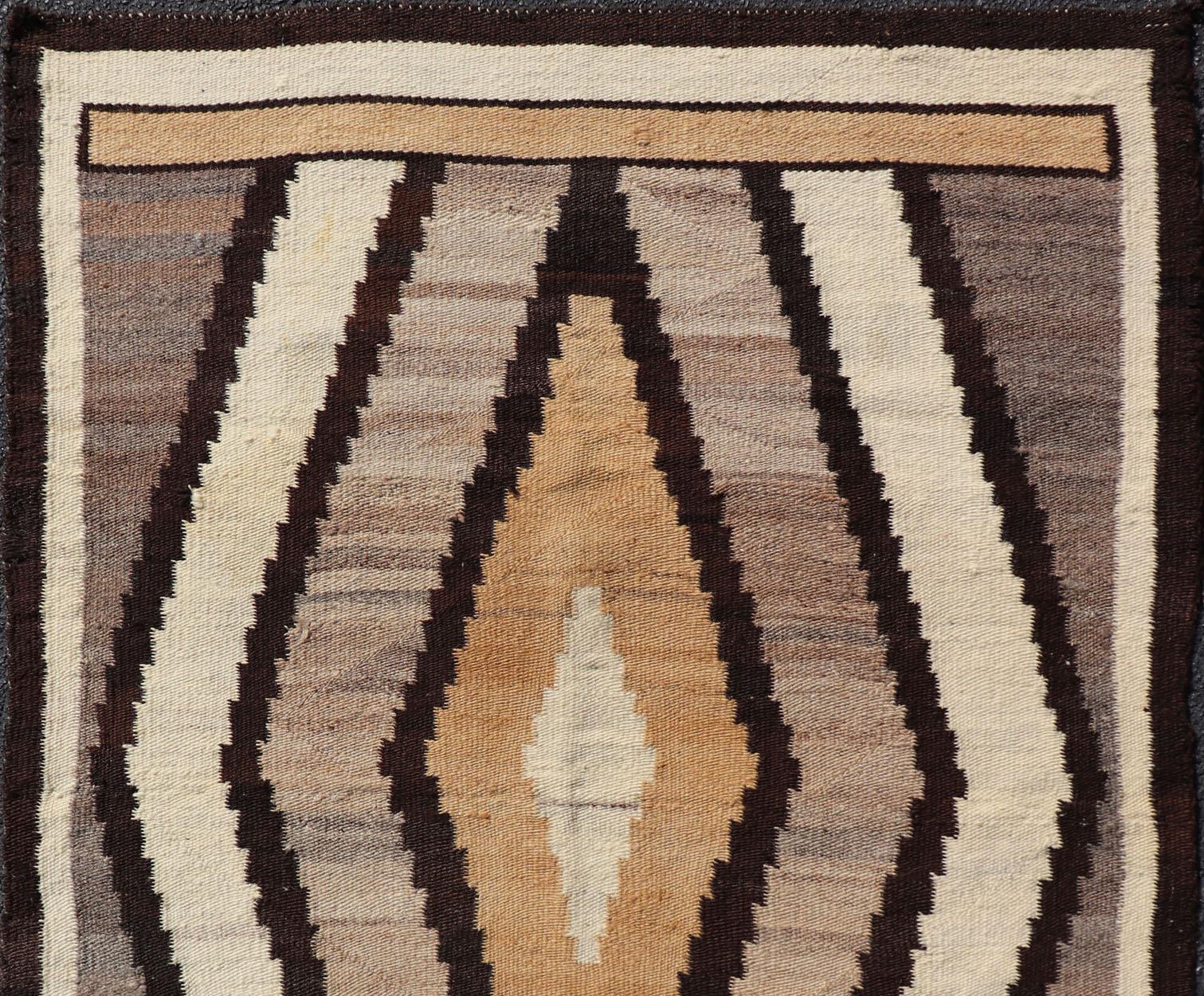 Hand-Woven 1940s Vintage Navajo Kilim with Tribal Diamond Design in Earthy Tones For Sale