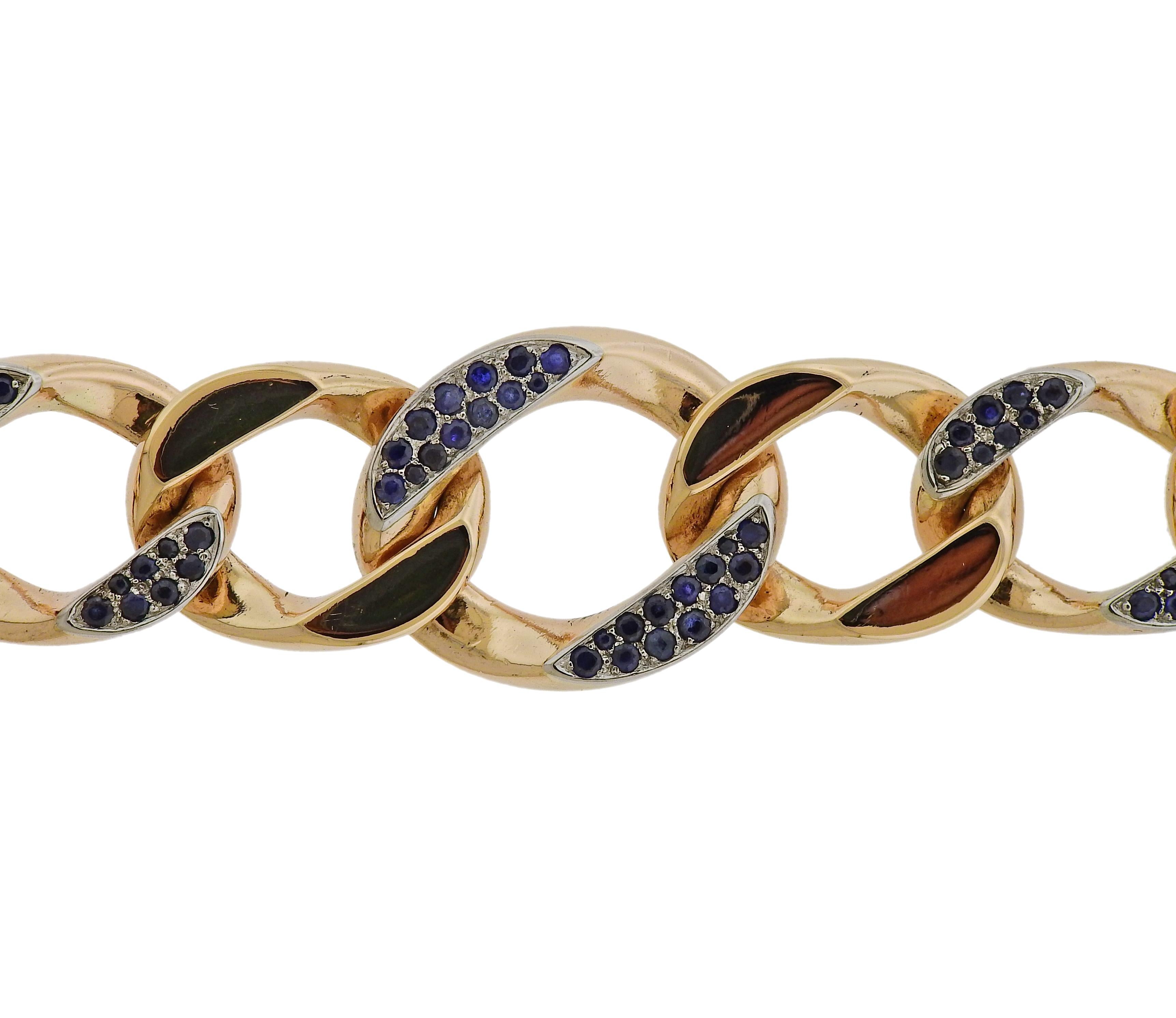Vintage circa 1940s 14k gold curb link bracelet by Seaman Schepps, set with blue sapphires.  Bracelet is 7 34