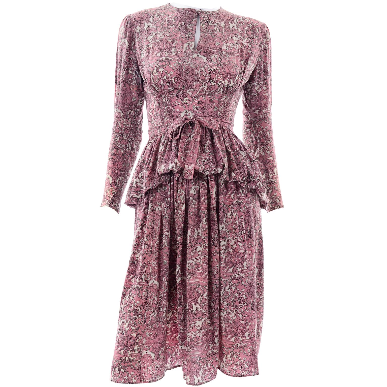 This pretty vintage silk 1940's WWII era dress has a fabric sash, a key hole opening at the neck, long sleeves and it closes with covered buttons up the back. We love the shirring at the waist and the peplum! Only flaw found is one button on one