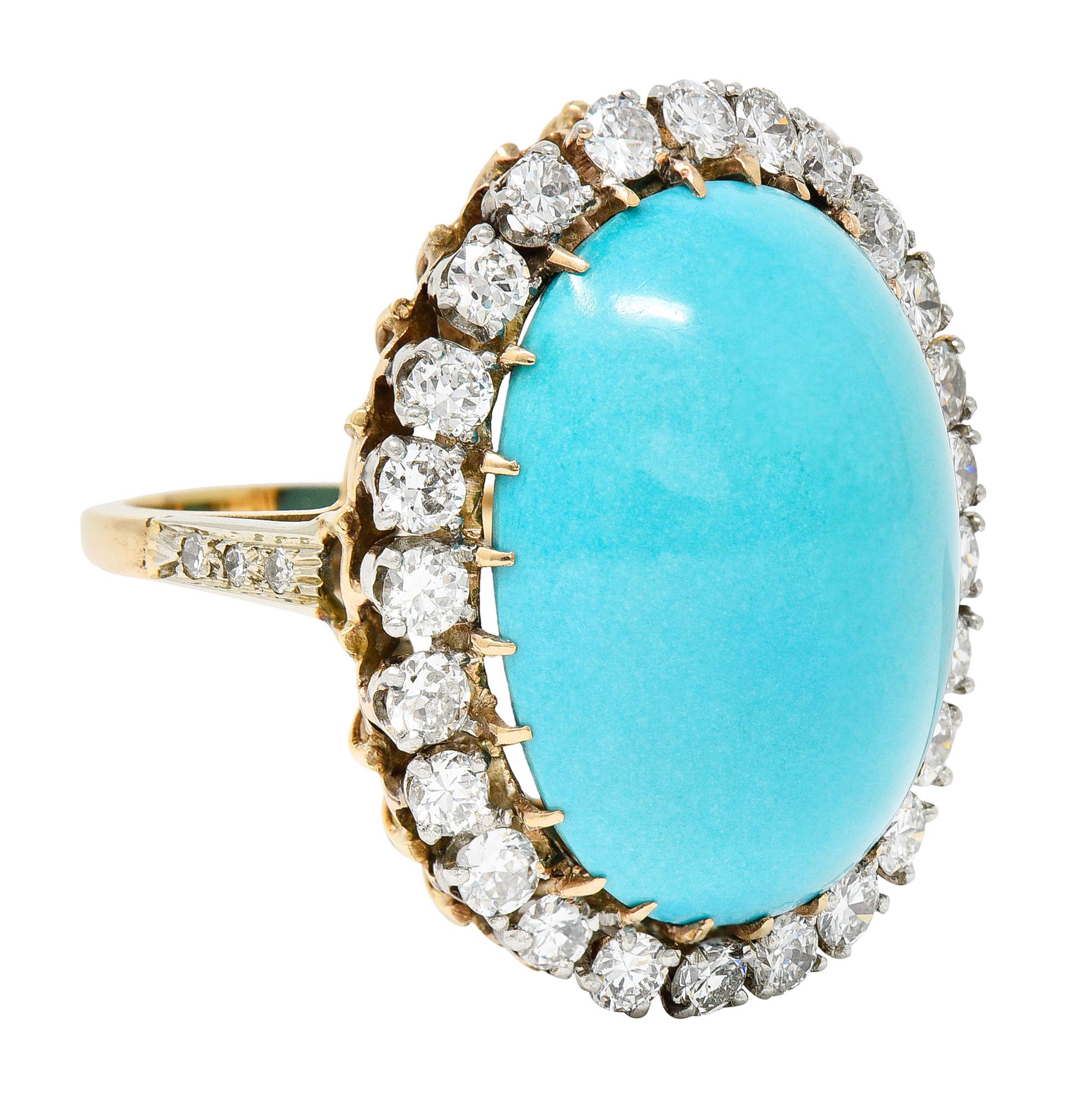 Substantial cluster ring features an oval turquoise cabochon measuring approximately 23.0 x 17.5 mm

Opaque and uniformly robin's egg blue with no front facing matrix - excellent polish

Talon set in yellow gold with a surround of round brilliant