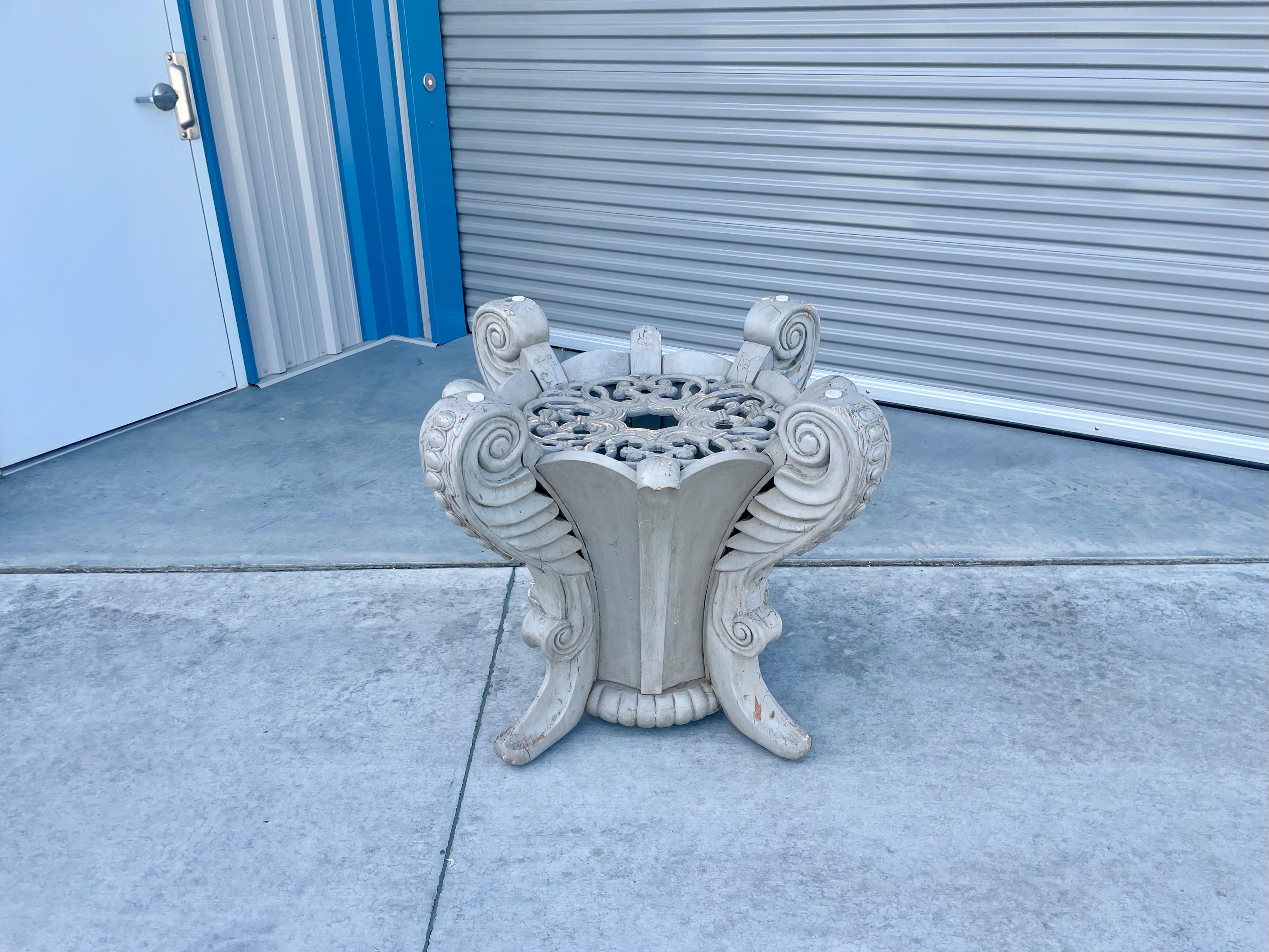 Vintage wood dining table base designed and manufactured in the United States circa 1940s. This beautiful base features a wooden frame and a lovely sculptured design surrounding the item. The base doesn't have a glass, but you can easily have custom