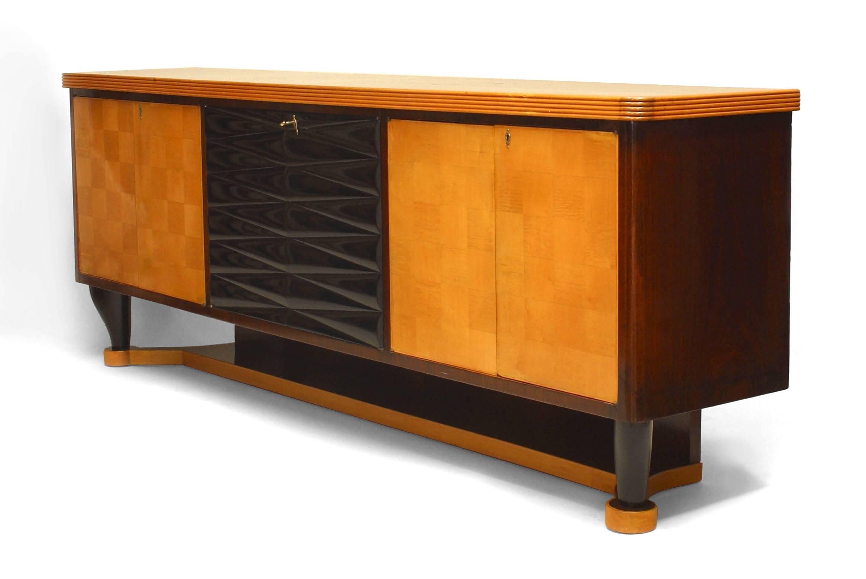 Italian mid-century (1940s) mahogany sideboard with 4 maple parquetry doors centering a Pair of ebonized doors and supported on 4 ebonized legs over a platform base (Attributed to VITTORIO DASSI).
   