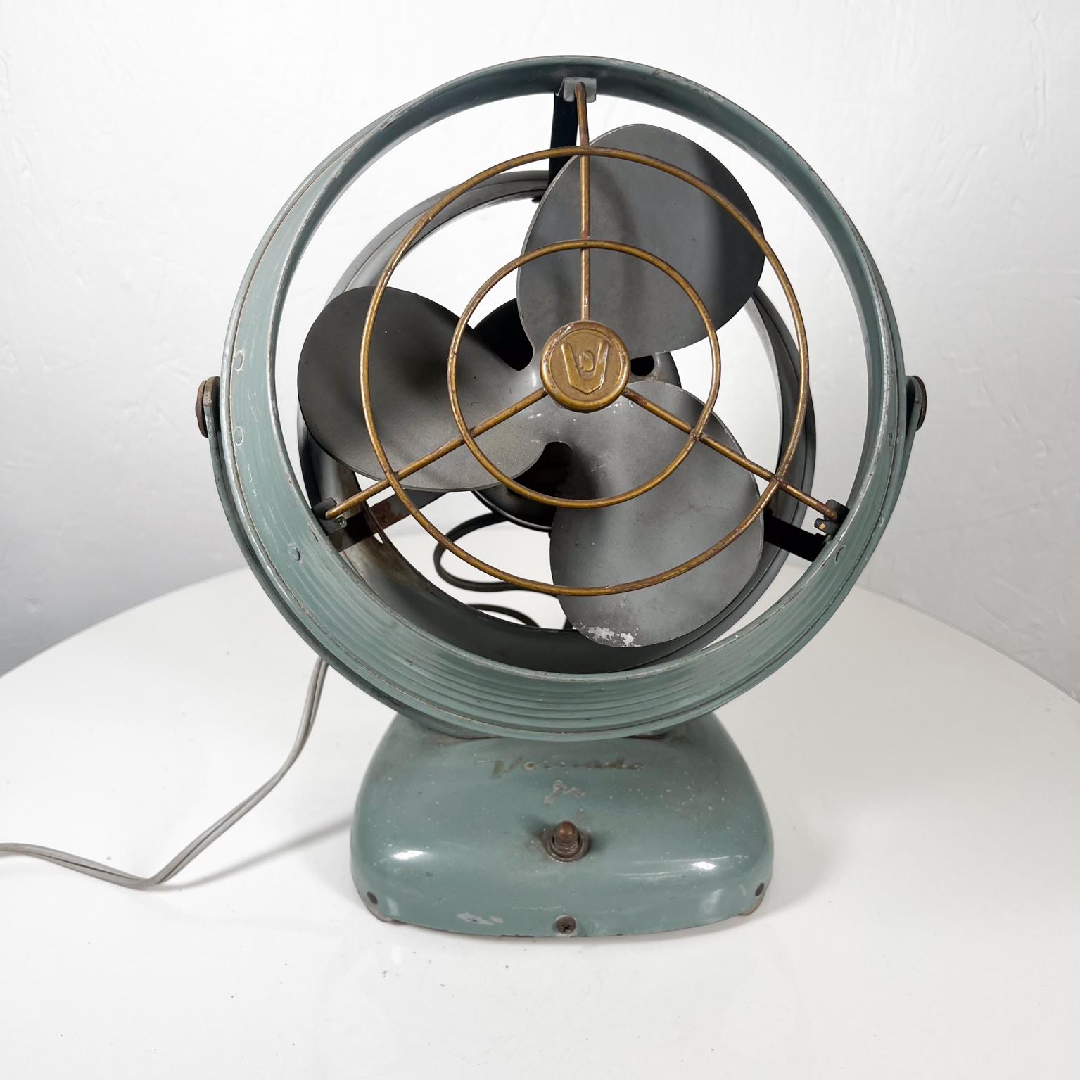 1940s Vornado vintage antique electric fan
powerful and silent
Stamped by maker
Art Deco era electric green desk tabletop fan
modern industrial design.
16 tall x 16 d x 24 w
Preowned original vintage condition. Rust present. Faded finish.
Refer to