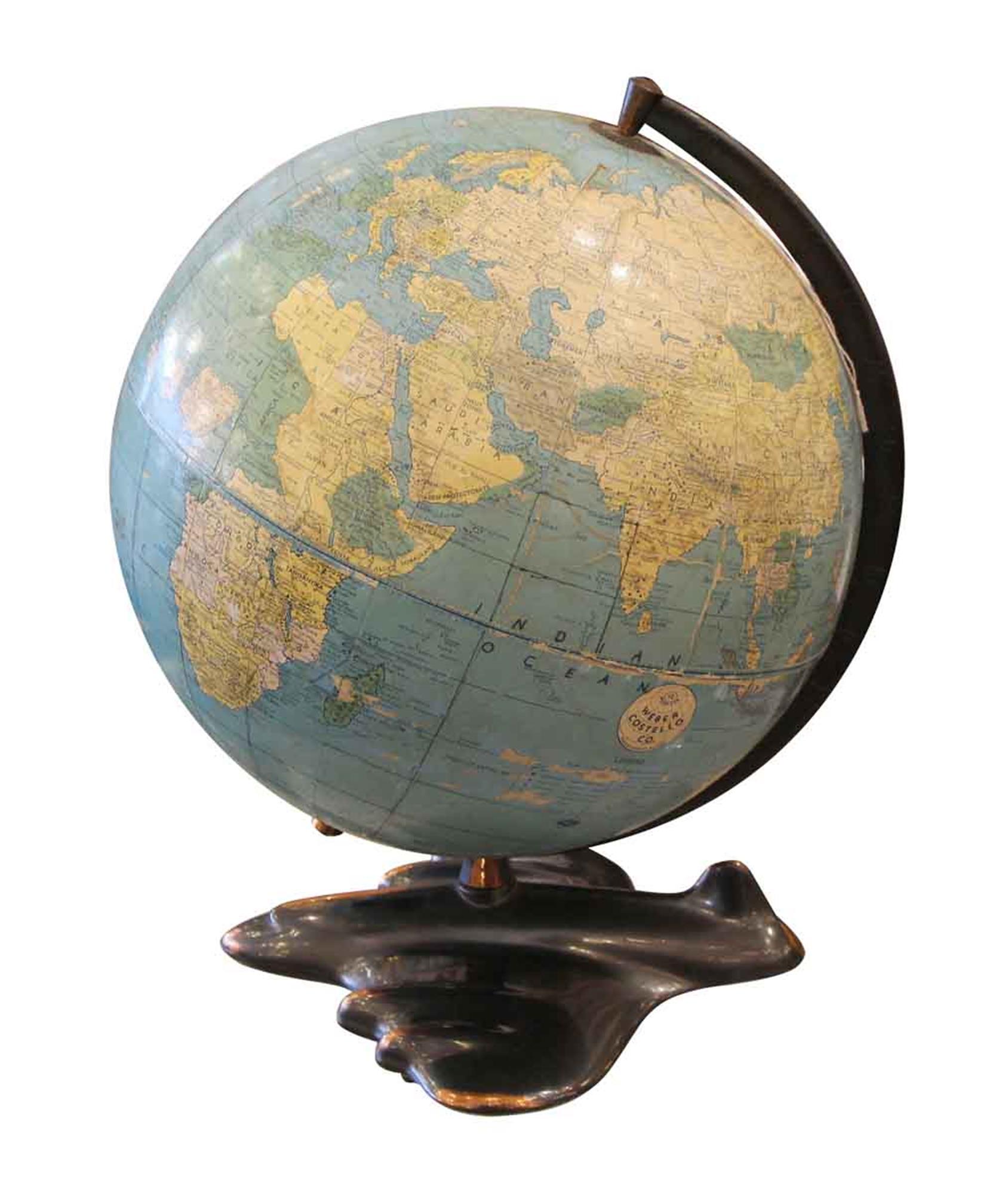 Early 1940s world globe with an airplane shaped Art Deco base with a copper wash. The globe has some worn areas. Made by Weber Costello Co. This can be seen at our 302 Bowery location in Manhattan.