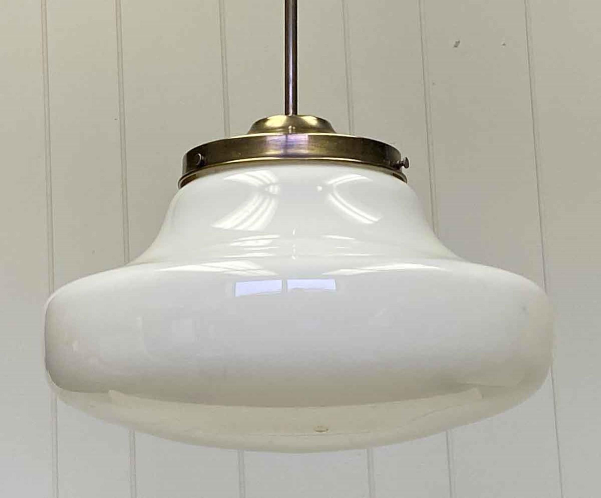 1940s large white milk glass globe fitted with a modern newly made brass pole fitter. Small quantity available at time of posting. Priced each. Please inquire. Please note, this item is located in our Scranton, PA location.
