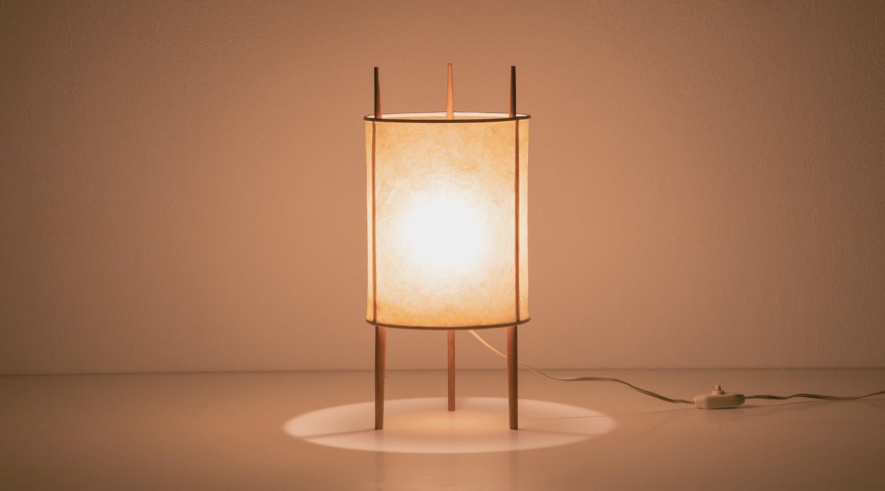 Sculptural light, table lamp by Isamu Noguchi, USA, 1947.

Beautiful table lamp by Isamu Noguchi. The shade is made out of fiberglas-reinforced polyvinyl and stands on three wooden sticks. The lamp promises a very warm, pleasant light.