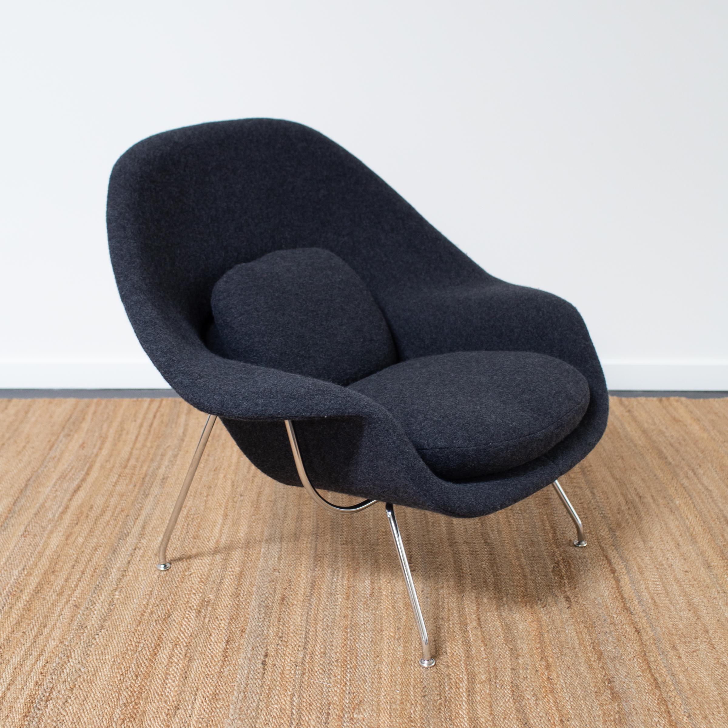A vintage Womb chair and Ottoman by Eero Saarinen for Knoll International. The chair and ottoman have new feather-down cushions and are reupholstered in a Holland & Sherry boiled wool. 

About Eero Saarinen and the Womb chair
A Finnish born