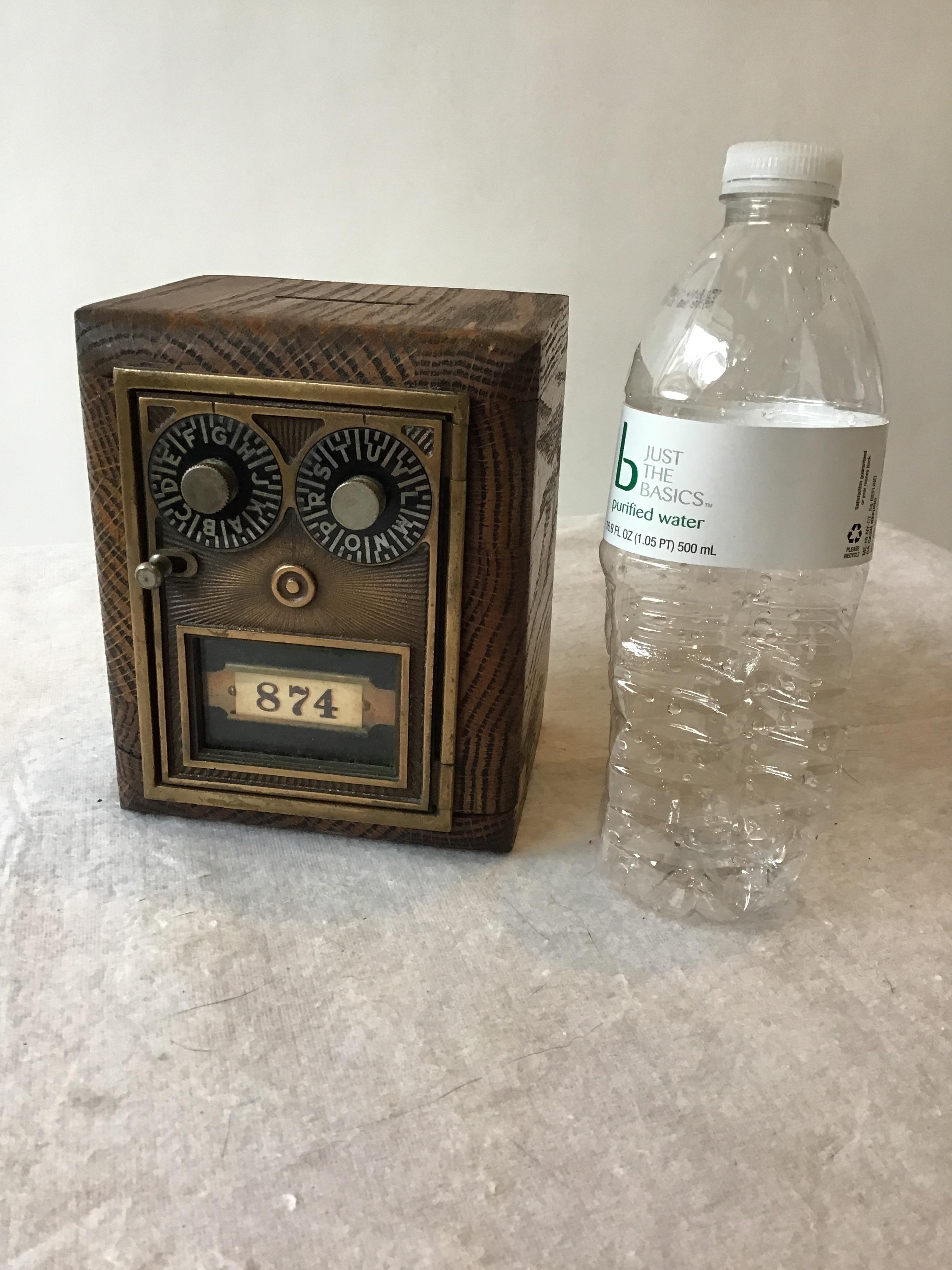 1940s wood bank by The Streeter Company. Still has the original combination label on the bottom.