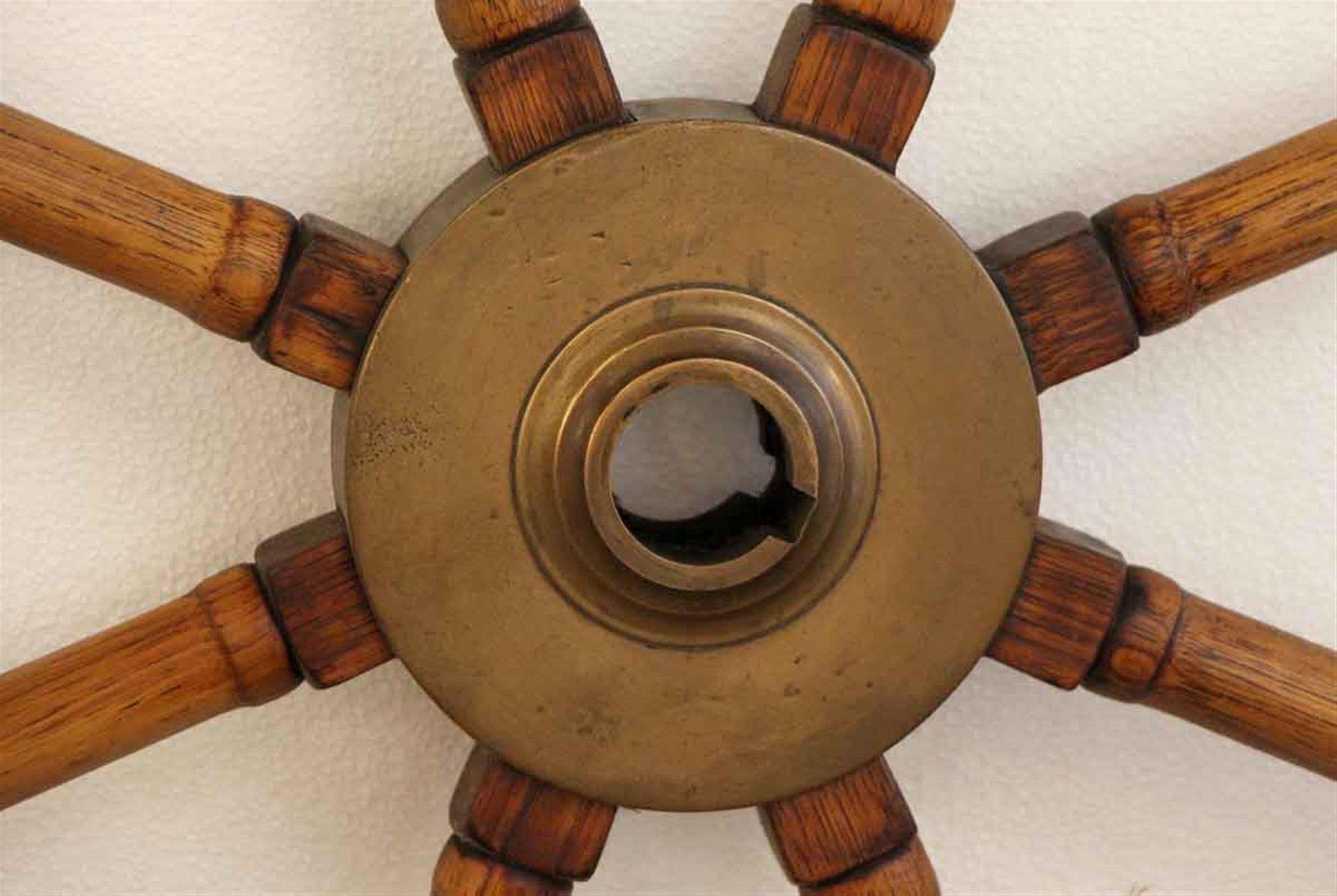 1940s old nautical wooden ship wheel with a bronze center hub. Good size with wood spokes. This can be viewed at one of our New York City locations. Please inquire for the exact address.
