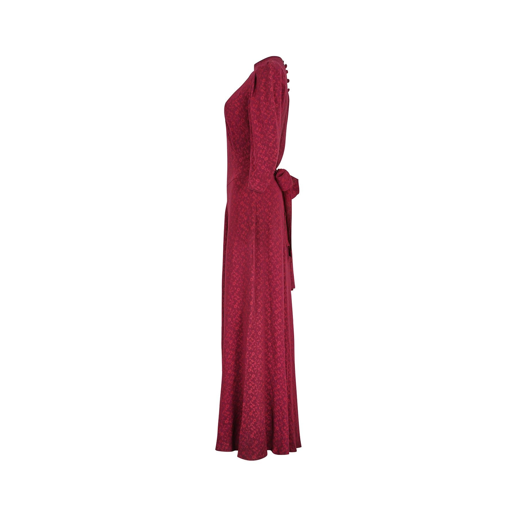 Very late 1930s to early 1940s floral print burgundy textured crepe dress.  Old Hollywood full-length style with a fitted and inverted T shaped bodice and wide waist band with a flared skirt. It has a high round neck and dainty puffed three-quarter