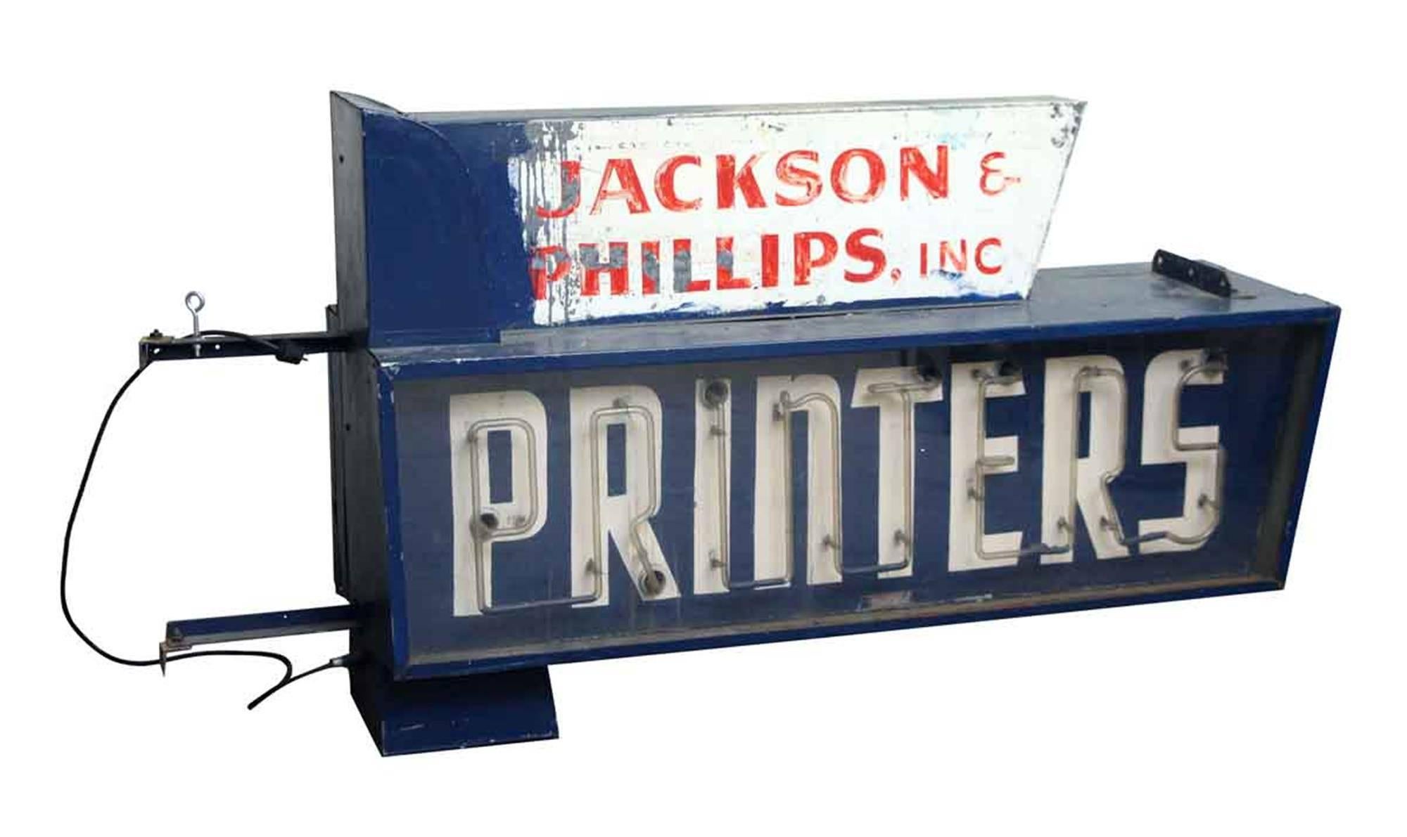 Original blue side hung Jackson & Philips, Inc. Printers neon building sign. From the 1940s. Double-sided. Shows wear from age and use. This can be seen at our 2420 Broadway location on the upper west side in Manhattan.