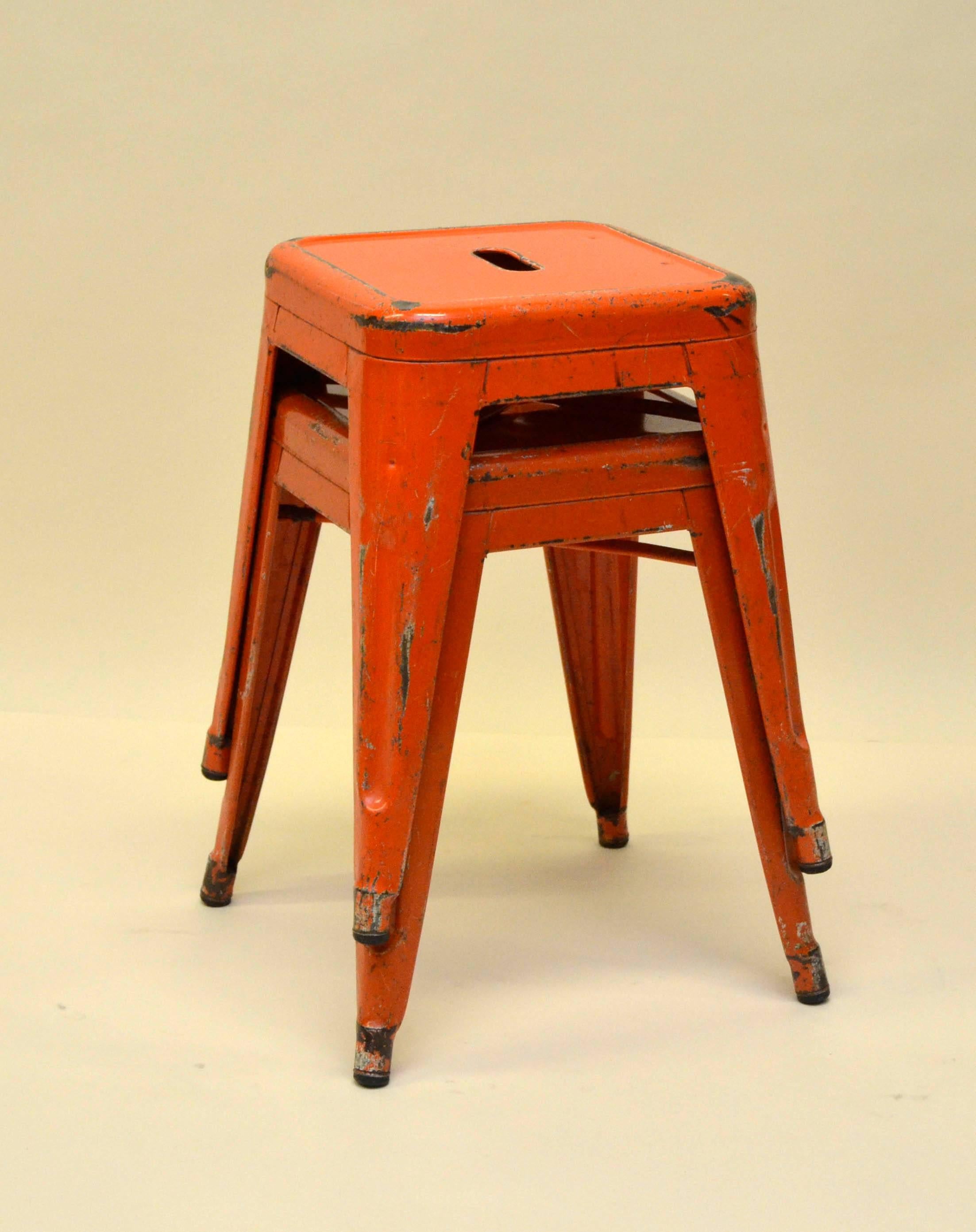 1940s Xavier Pauchard pair of French industrial model H45 metal Tolix stools with original orange enamel color.

Collector’s note:

Xavier Pauchard was born in the thickly wooded Morvan region of Burgundy, France, and began his career as a