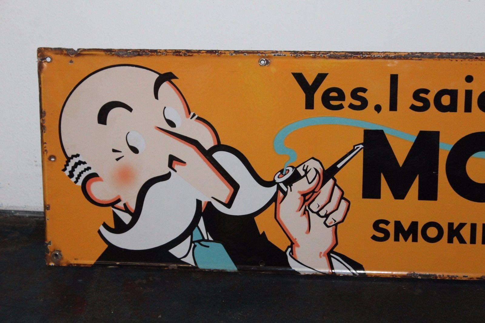 This awesome 1940s porcelain sign was made to advertising Model Tobacco. This tobacco was normally used for pipes during WW11.