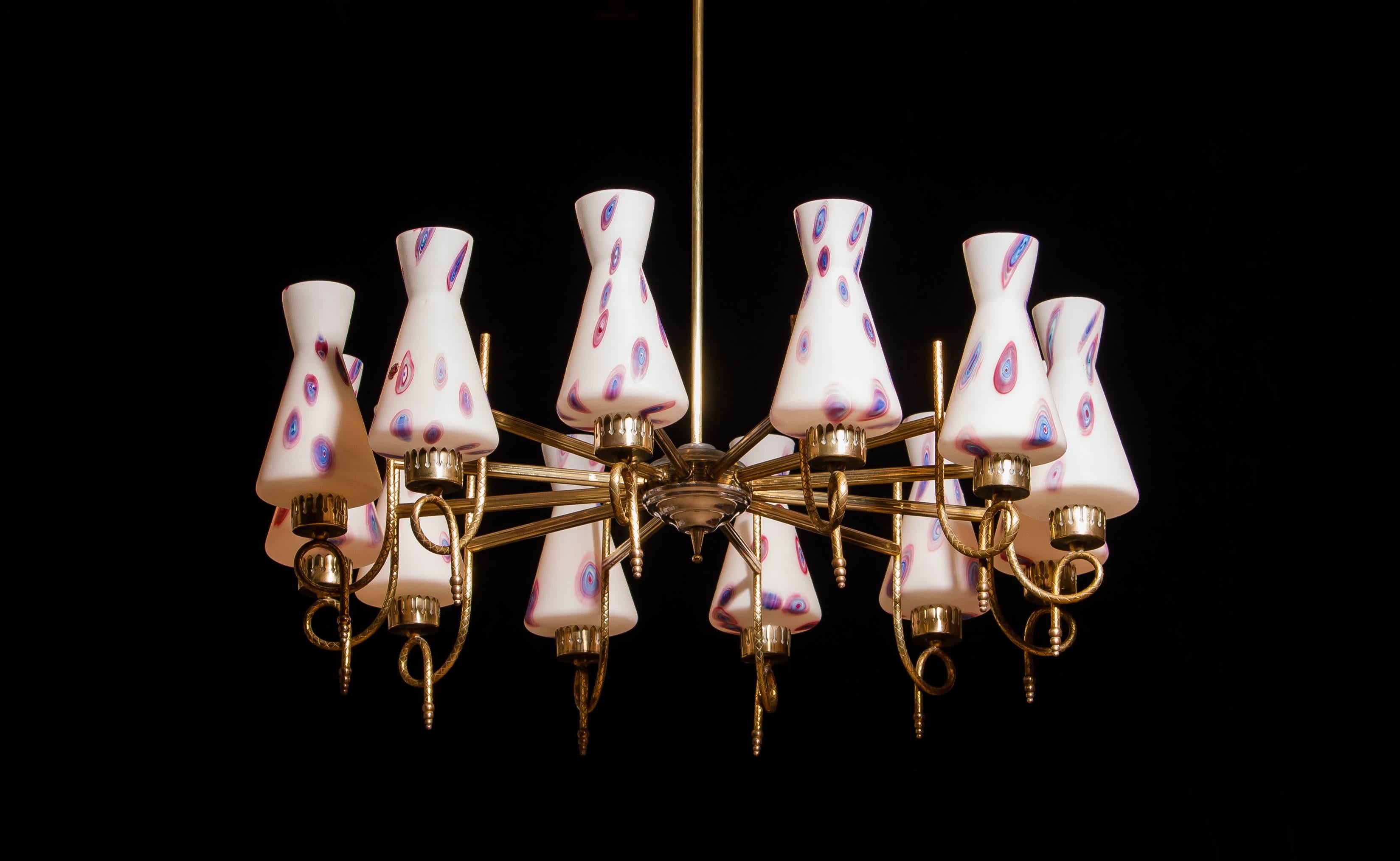 Magnificent large chandelier.
This lamp is made of a beautiful brass with polished aluminium shape with twelve white designed Murano glass shades.
The shades are labelled.
It is in an excellent working condition.
Period 1940s
Dimensions: H.90