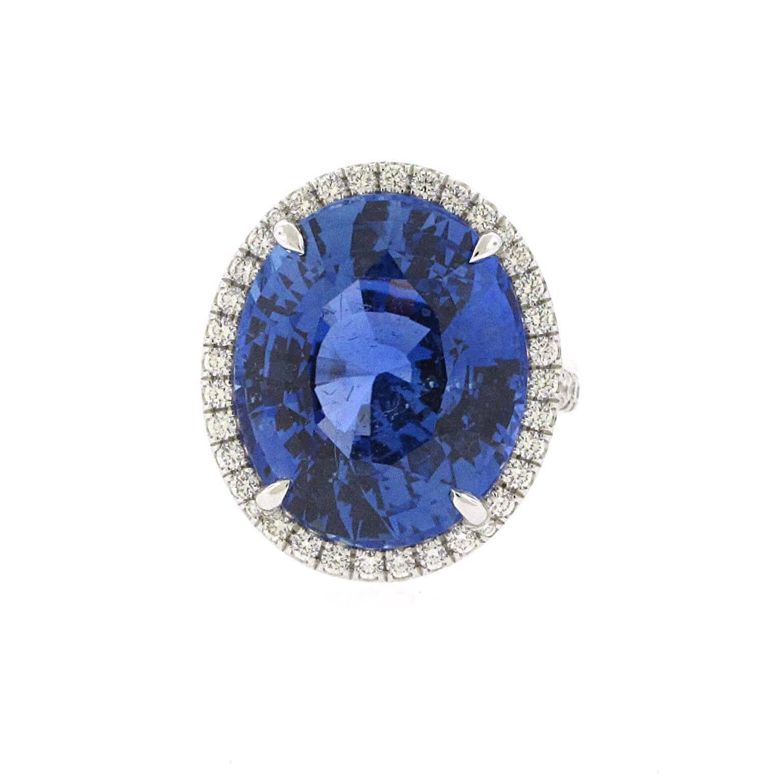 This is the ring of all rings. Nearly 20 carat Ceylon / Sri Lanka sapphire. This sapphire is the true blue color that you would want in a ring. It is a gorgeous oval accented with a fine diamond pave halo. Almost 1 carat of fine white diamonds. The