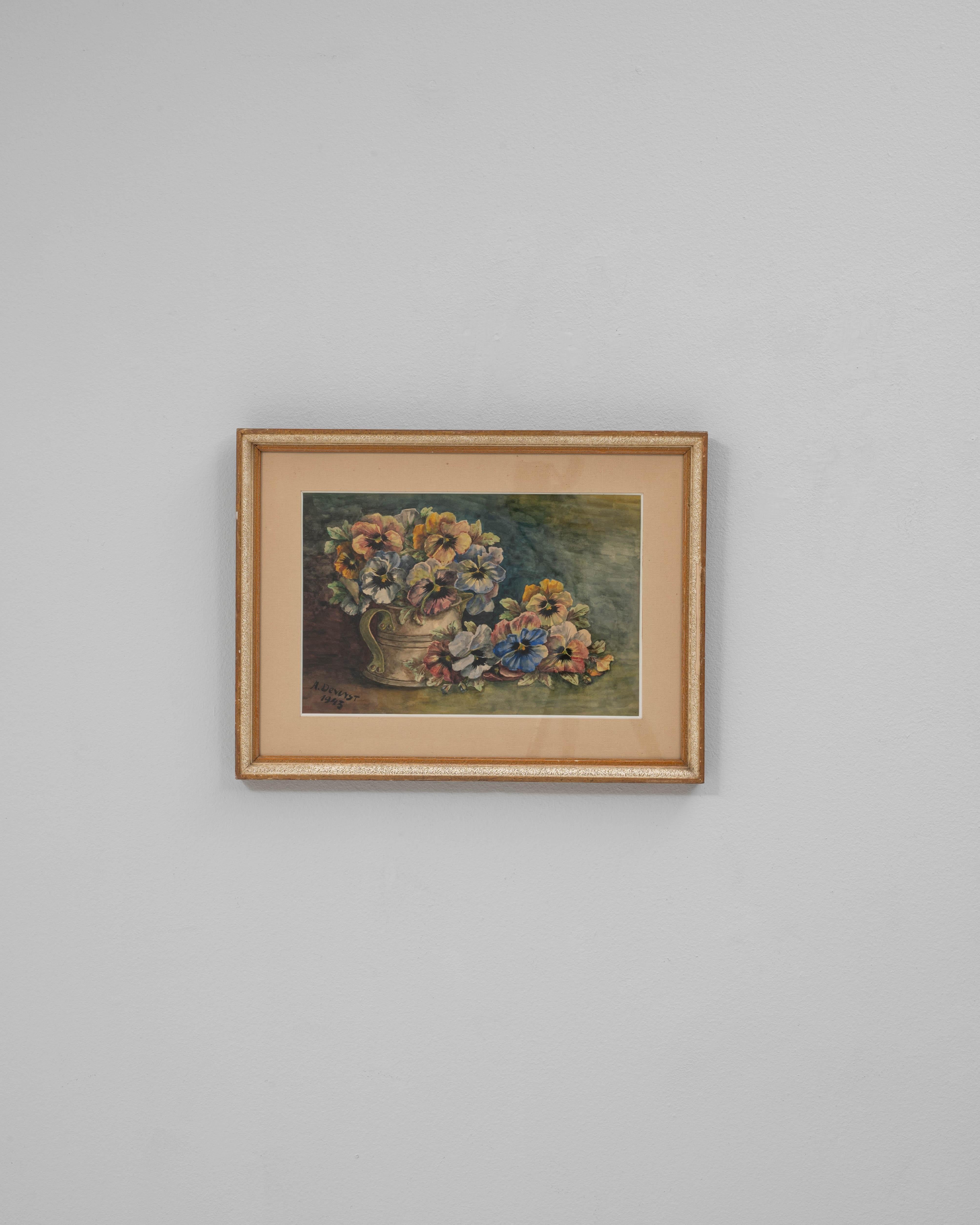 This 1943 Belgian wall art with wooden frame captures the charm of mid-20th century European still-life painting. Featuring a vibrant arrangement of flowers in a decorative vase, the composition highlights the artist’s sensitivity to color and