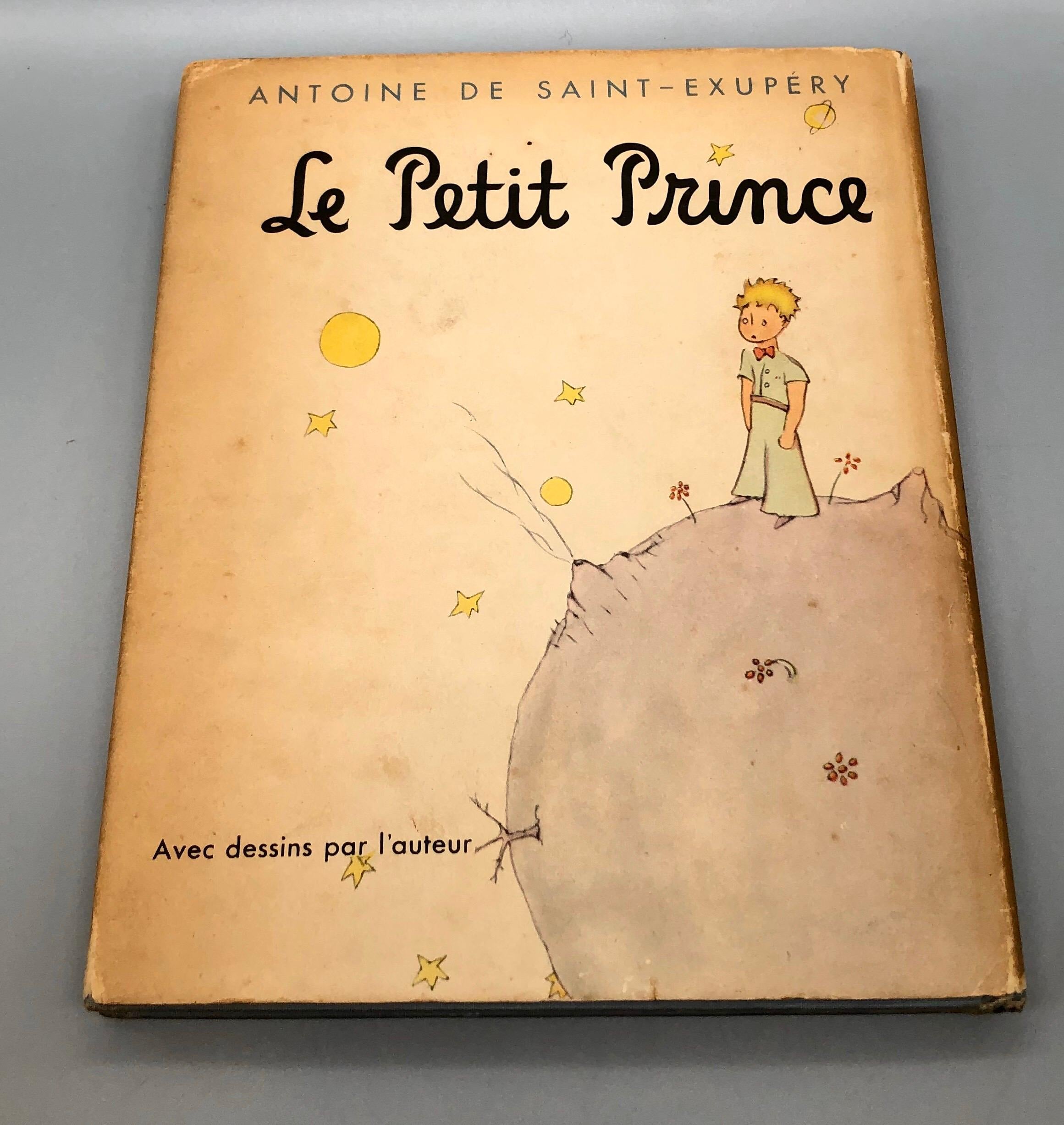 A very hard to find 1943 French edition of the childhood classic The Little Prince, published by Reynal & Hitchcock, New York, 1943. This is a second edition and includes dustjacket. The hardcover book is bound in blue-grey cloth and stamped