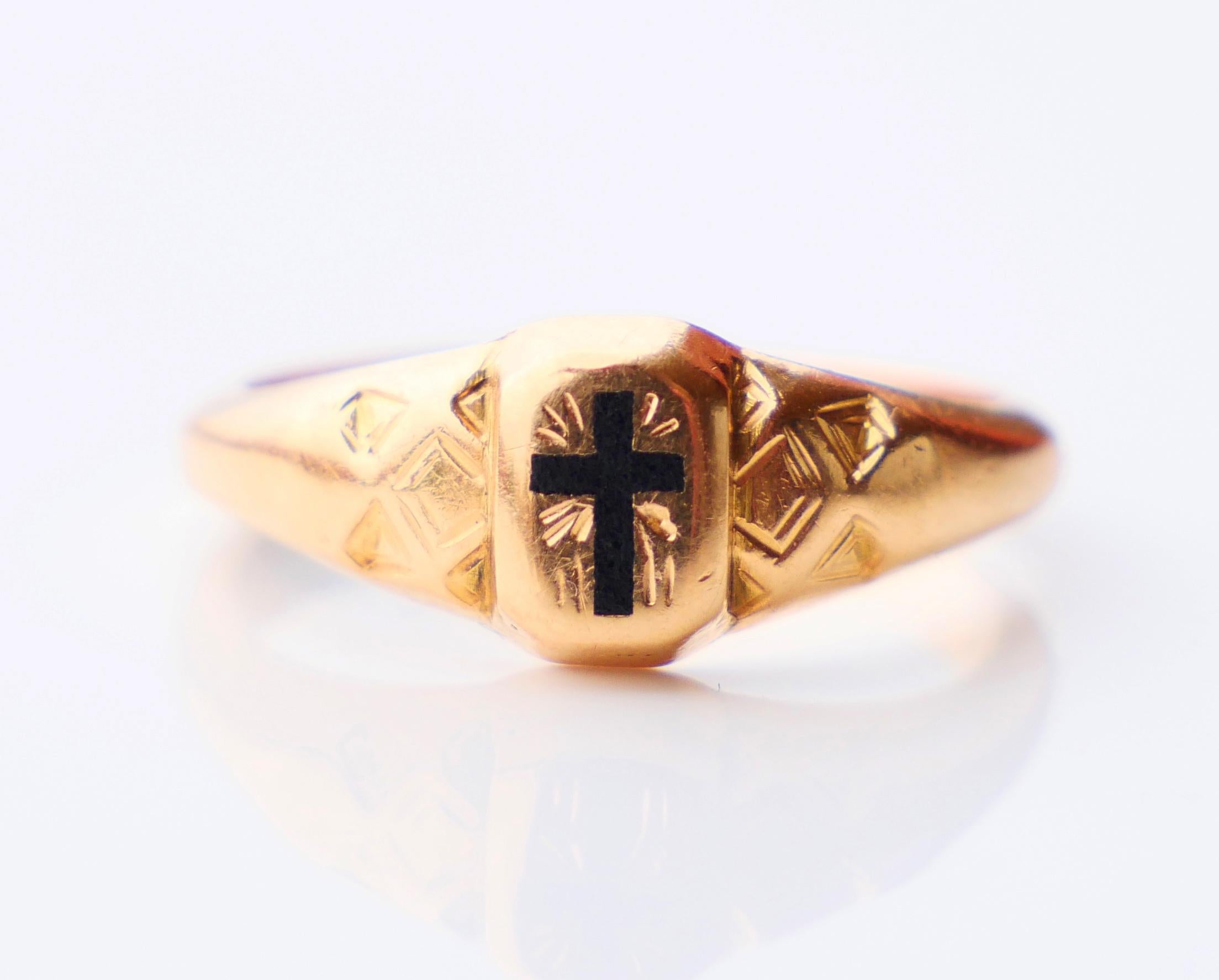 Ring in solid 18K Yellow Gold with hand - engraved shoulders and cross ornamentation filled with black Enamel on the face. Cross measures : 5mm x 3.3 mm . Crown measures 7.5 mm x 6mm x 2.6 mm deep.

Made for Men or Women.

Hand - made in Finland