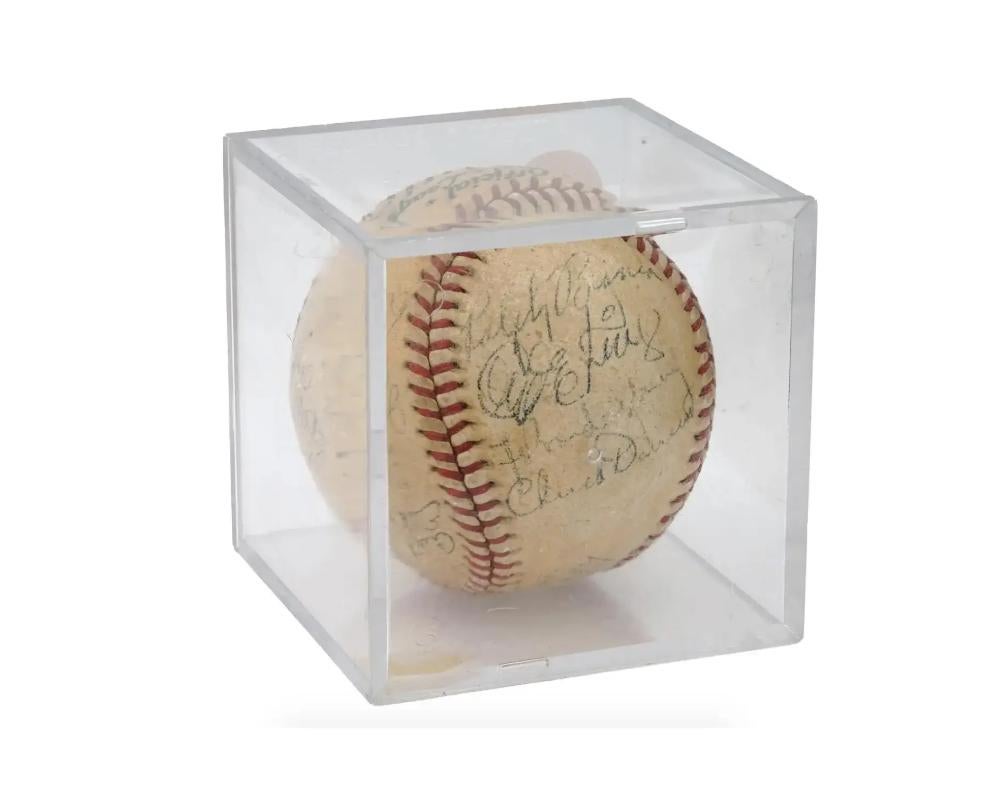 A baseball signed by the members of the Brooklyn Dodgers team. The ball was used in the 1945 National League. Includes signatures by Ralph Branca, Dixie Walker, Charlie Dressen, Les Webber, Curt Davis, Eddie Stanky. The item comes in display box